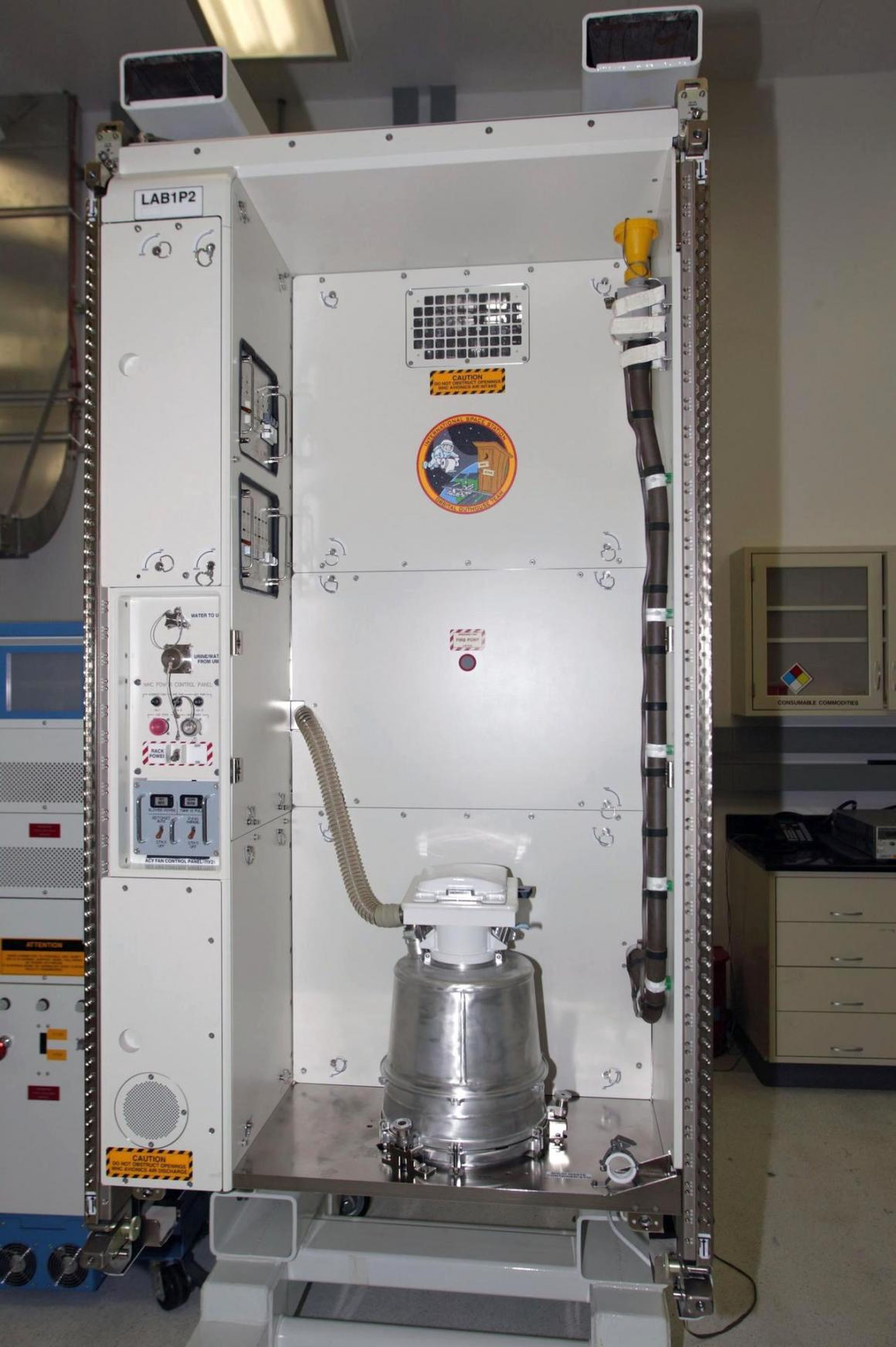 This waste and hygiene compartment was delivered to the International Space Station aboard space shuttle Endeavour. The Russian-built system separately channels liquid and solid waste.