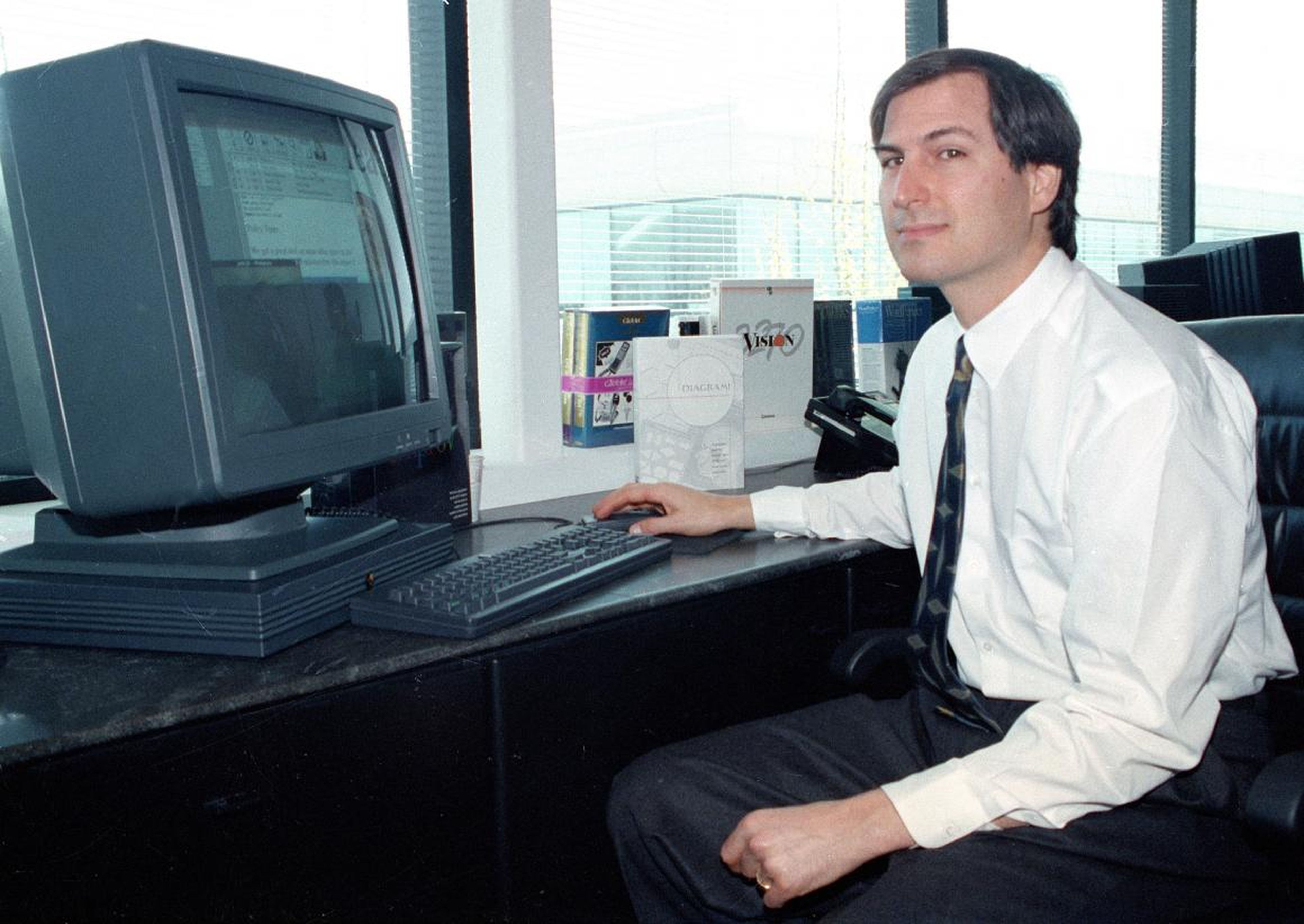 In this April 4, 1991, photo, Steve Jobs of NeXT Computer Inc. poses for the press with his NeXTstation color computer at the NeXT facility in Redwood City.