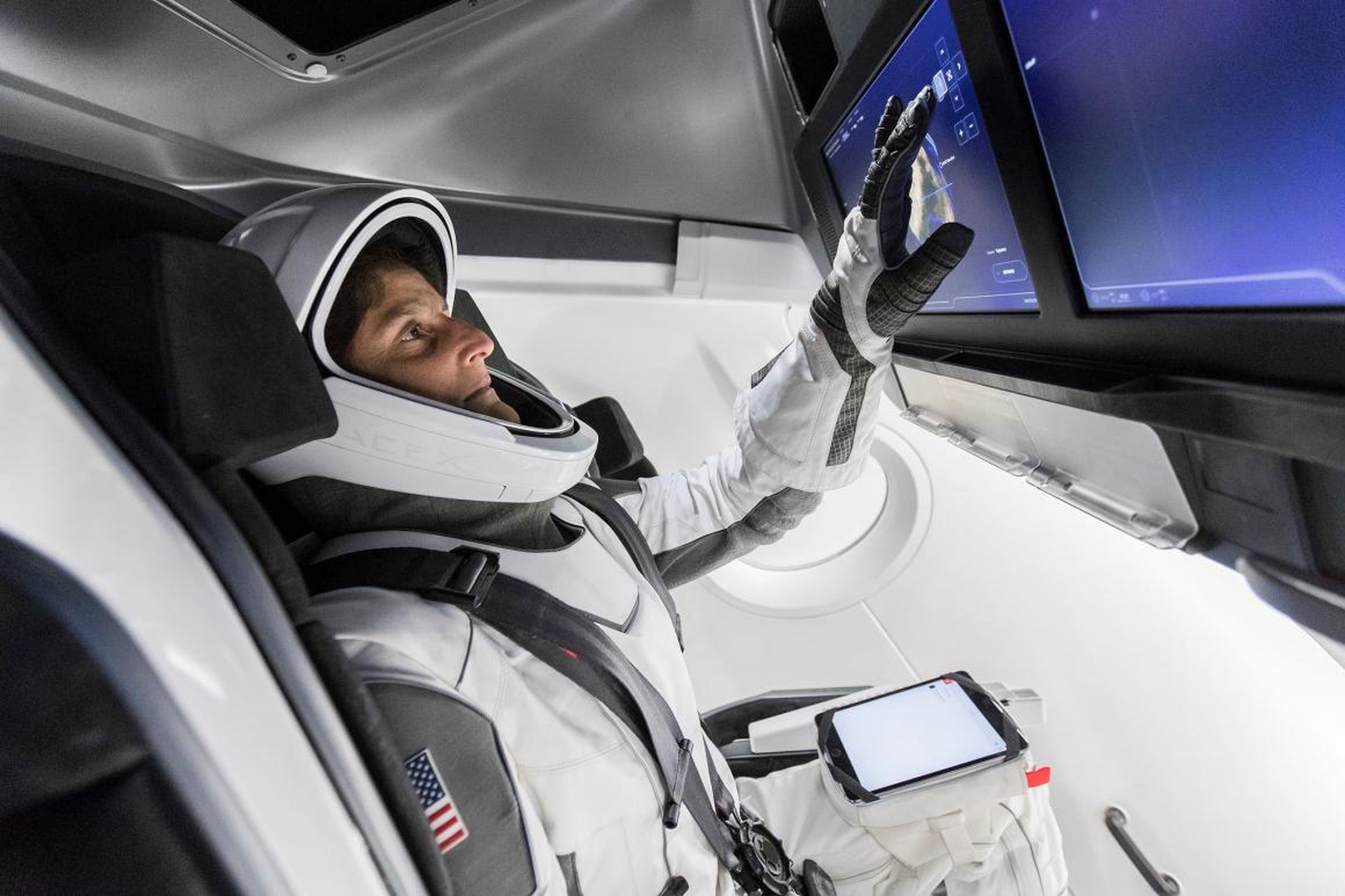 NASA astronaut and Commercial Crew member Sunita Williams tests mock-ups of SpaceX's Crew Dragon spaceship and spacesuit in April 2018.