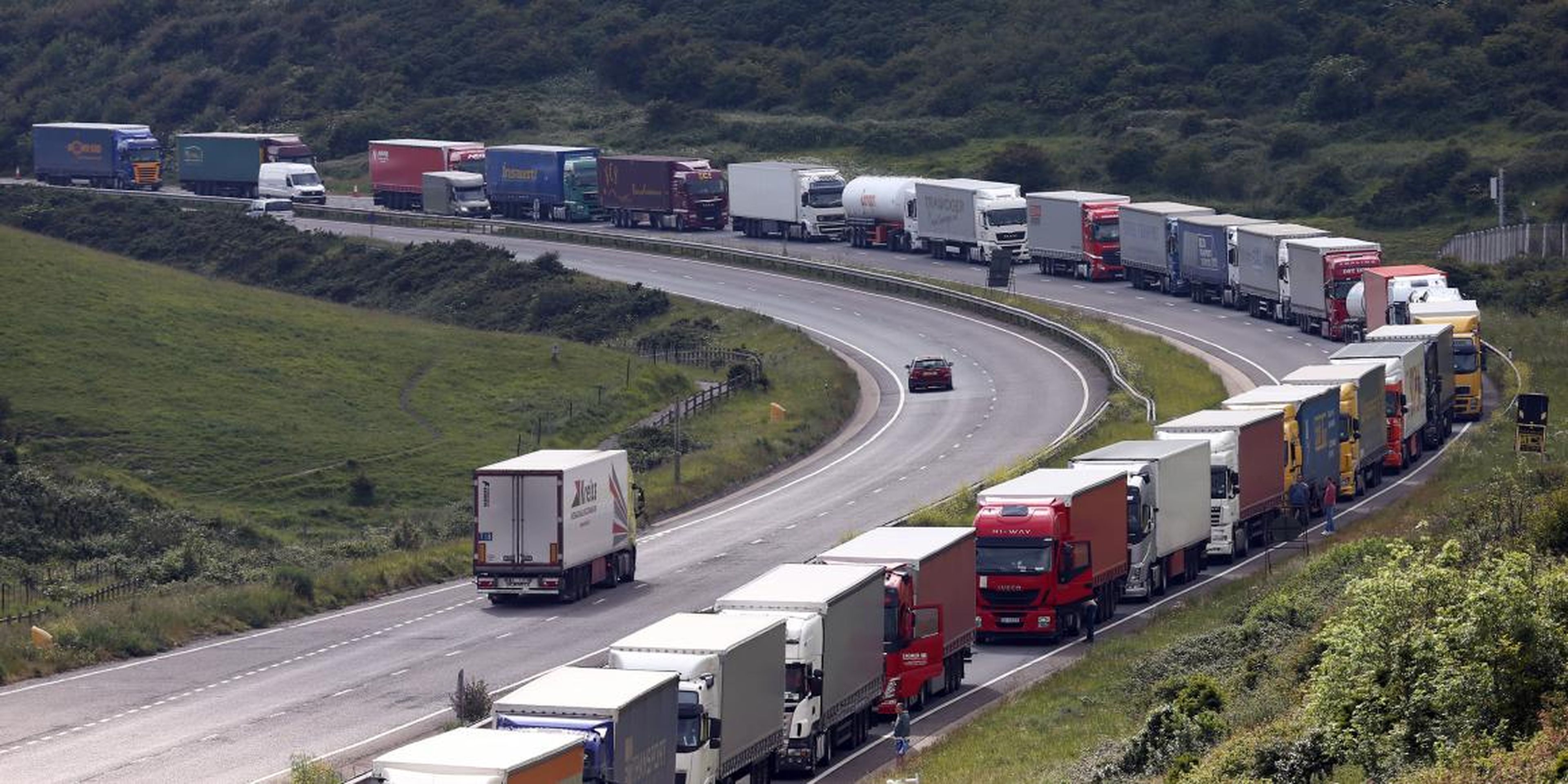 Trucks queue up as part of Operation Stack on June 23, 2015 in Dover, England. Ferry workers blockaded the port of Calais in a protest over job cuts earlier on Tuesday.