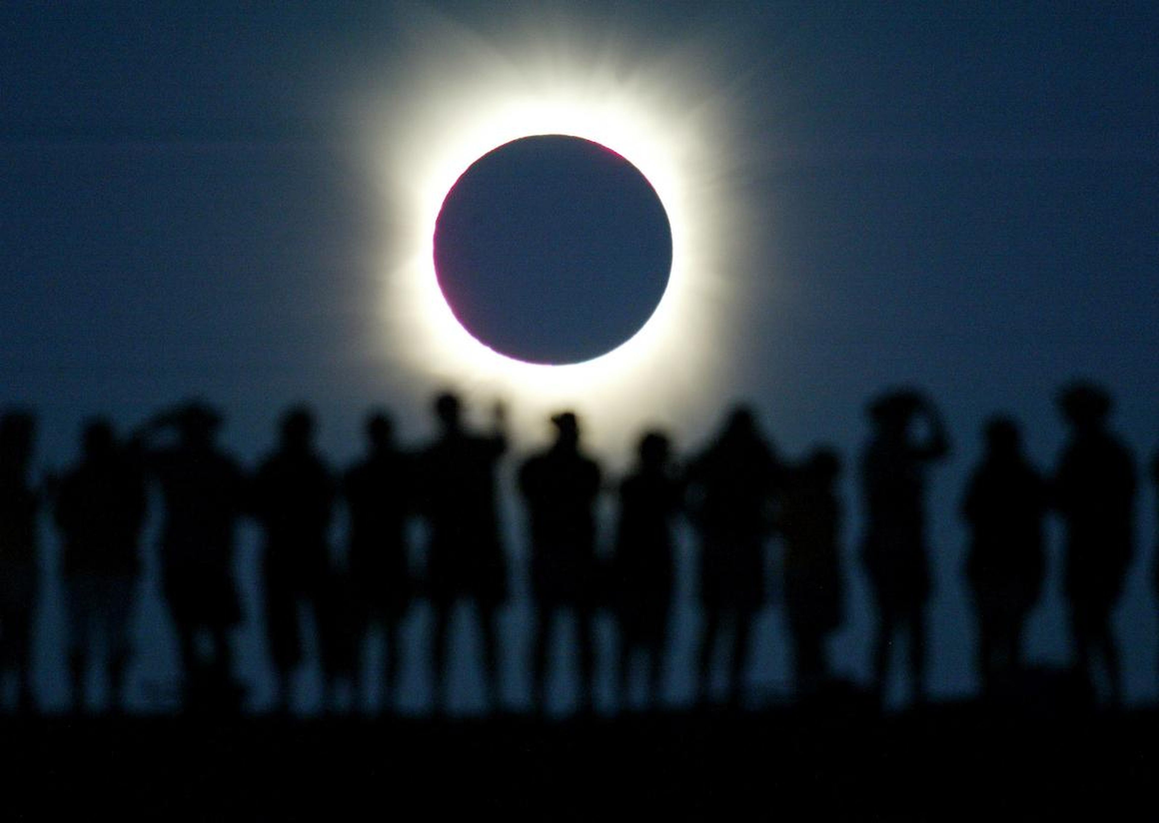 Viewers watch a total solar eclipse.