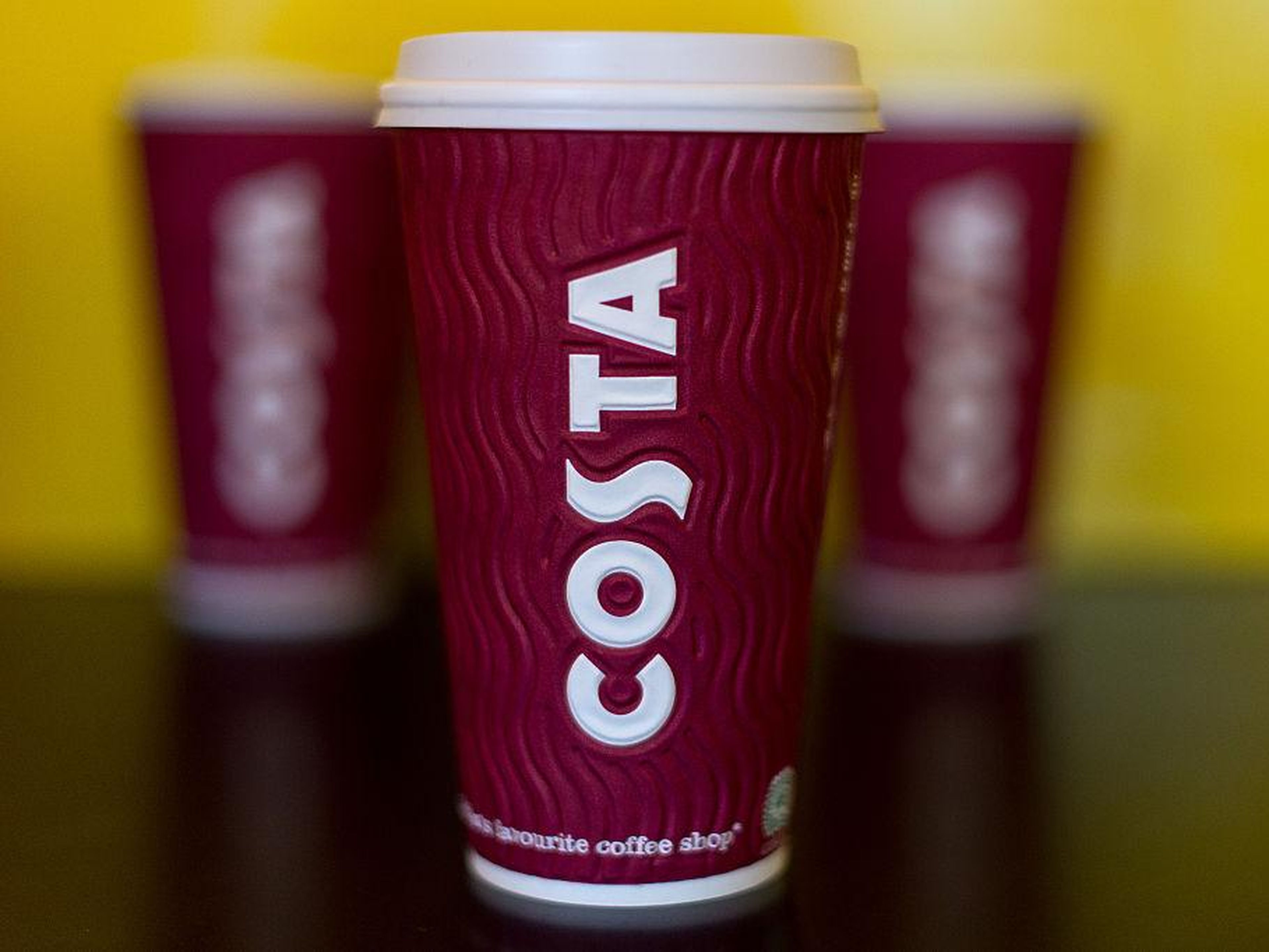 A collection of large sized Costa Coffee take away cups.