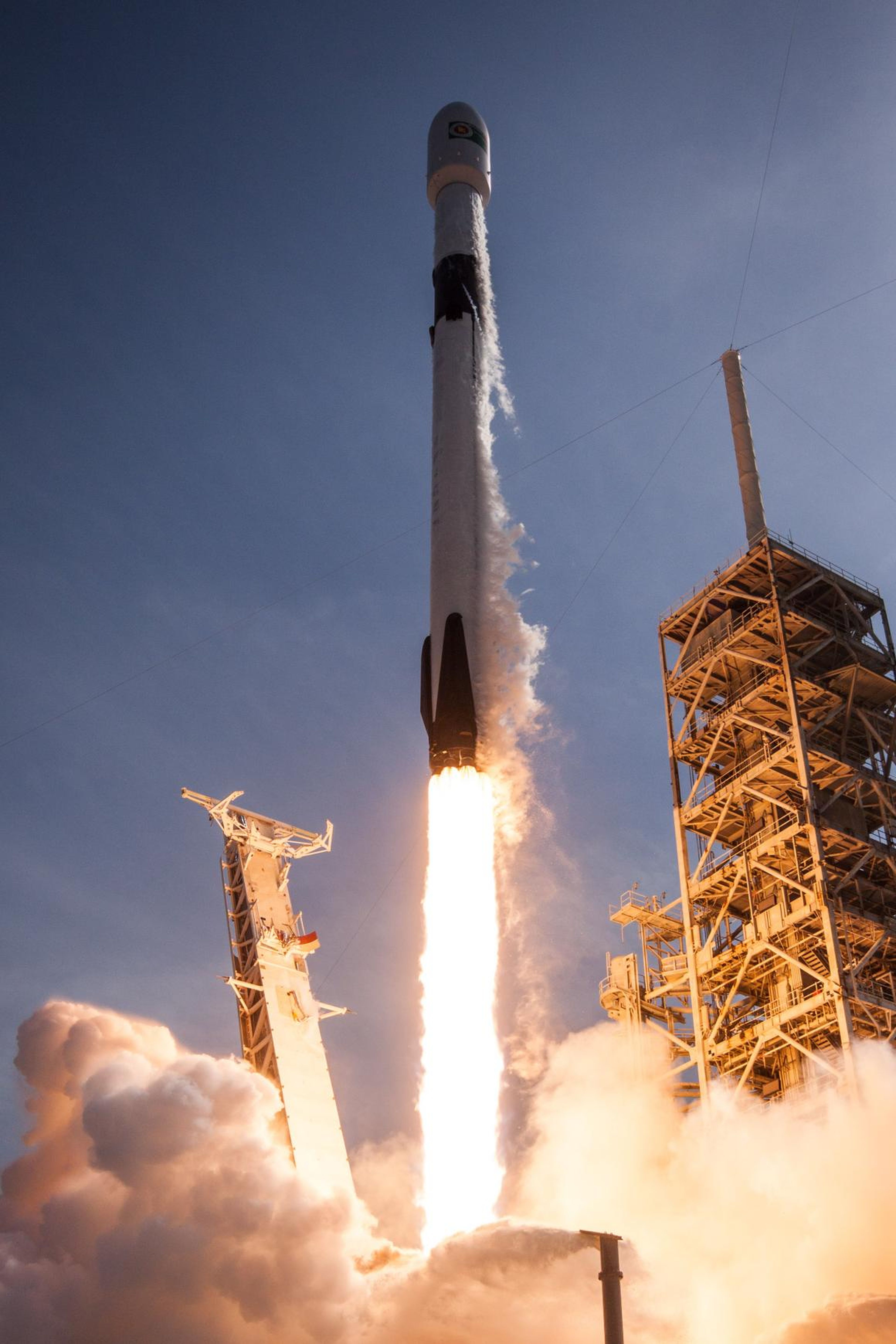 A Falcon 9 rocket launching toward space.