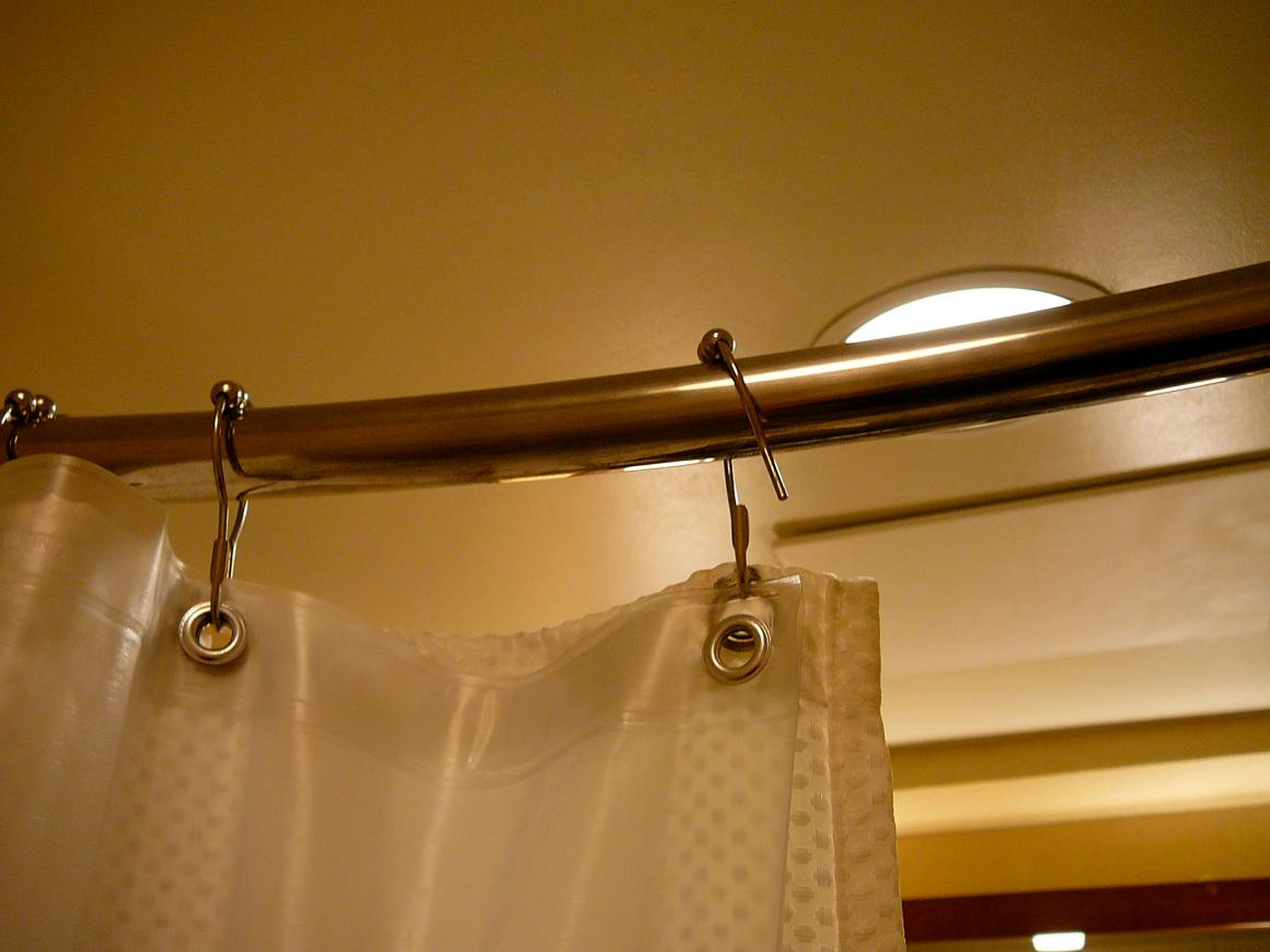 If you have a plastic shower curtain, put it in the wash every one to two weeks.