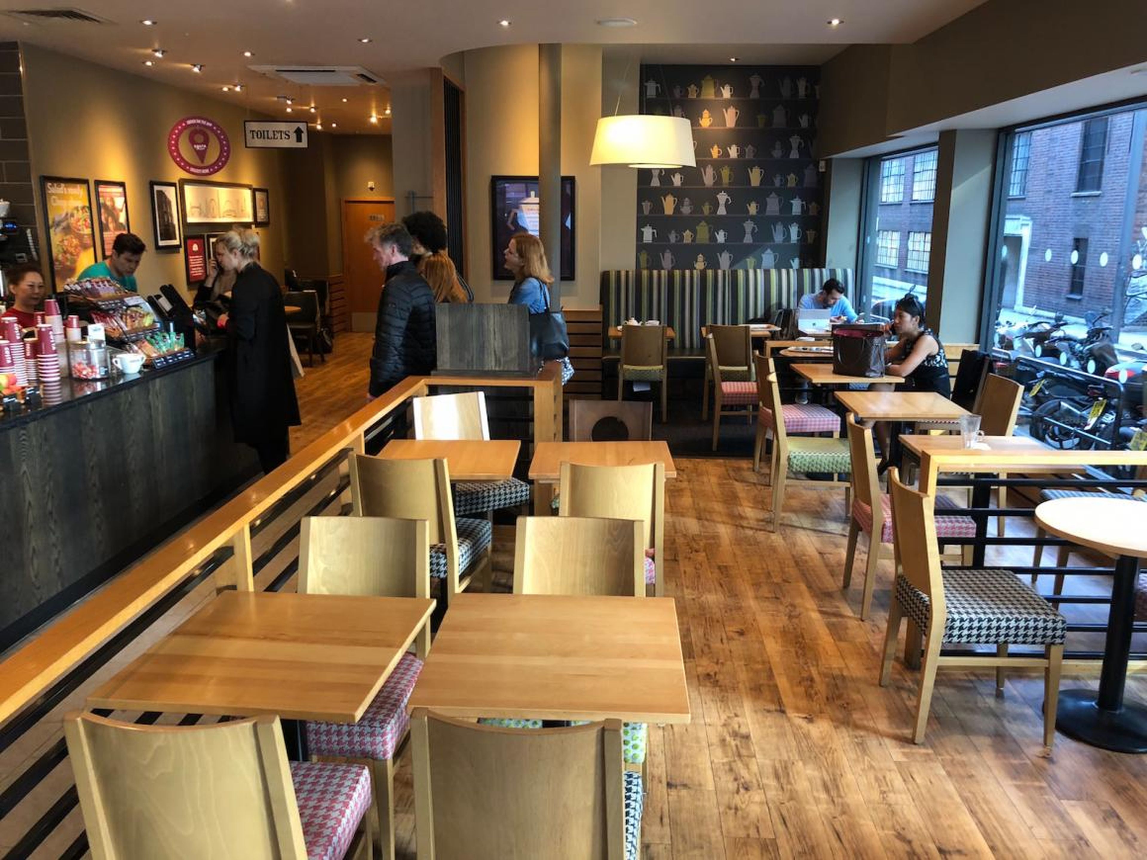 Inside, Costa Coffee is a very bog-standard coffee shop. The decor, much like the food, is bland and inoffensive without being particularly nice. The store has no particular theme or style — it's just ... "coffee shop."