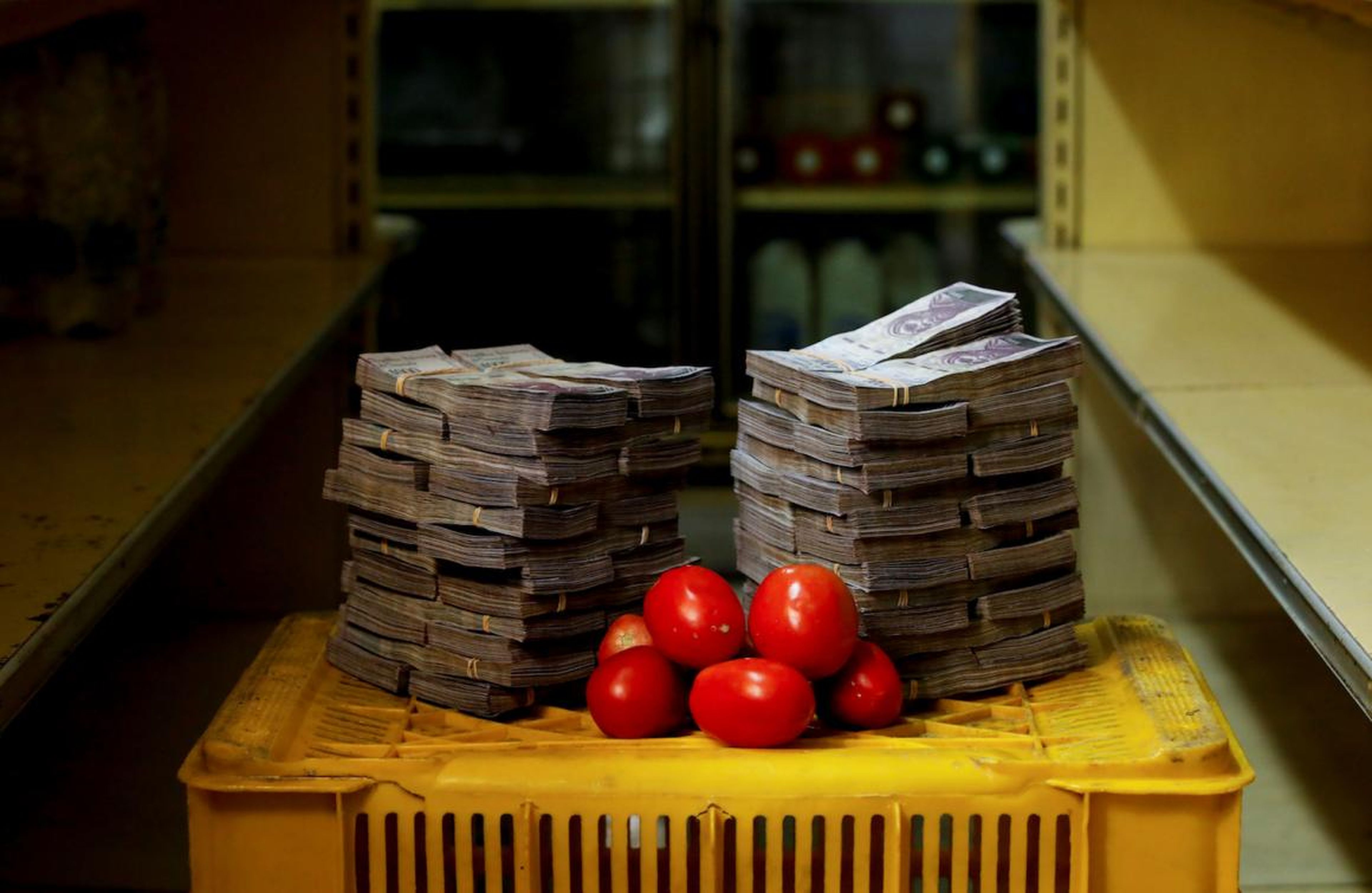 A kilogram of tomatoes next to 5 million bolívars, its price and the equivalent of $0.76, at a mini-market in Caracas, Venezuela.