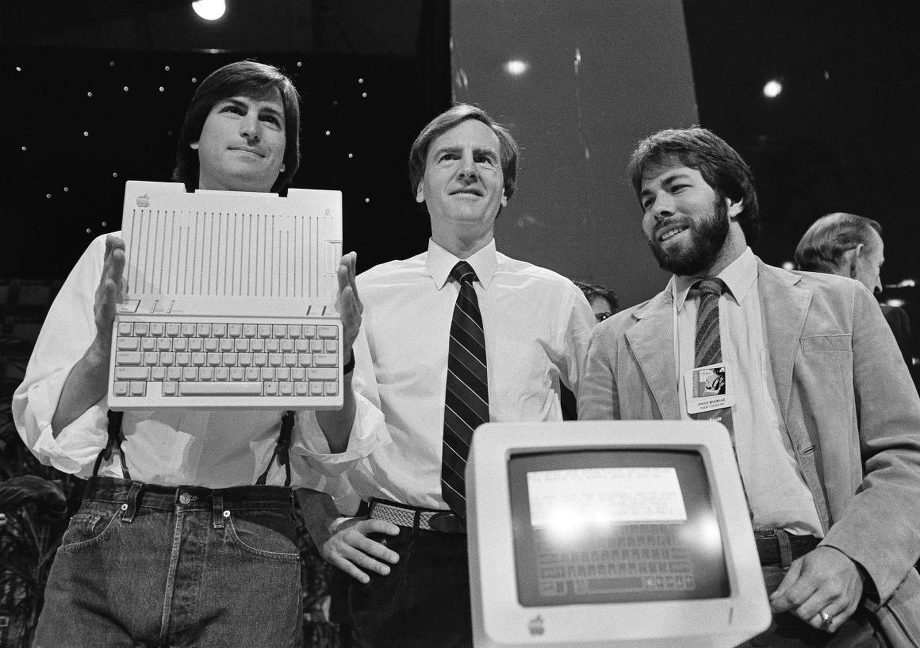 Steve Jobs, John Sculley, and Steve Wozniak launch the Apple IIc in 1984.