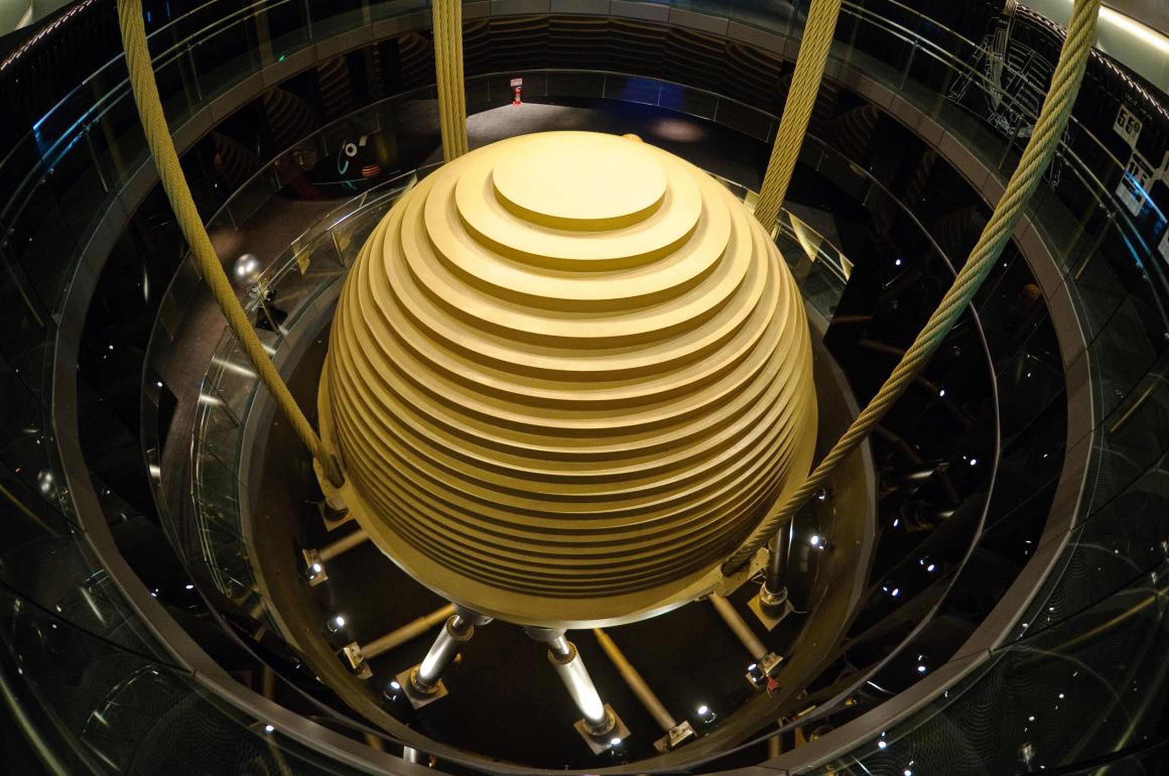 The skyscraper features a giant sphere painted gold, which spans its 87th through 92nd floors. The other levels contain offices, shops, and a restaurant.