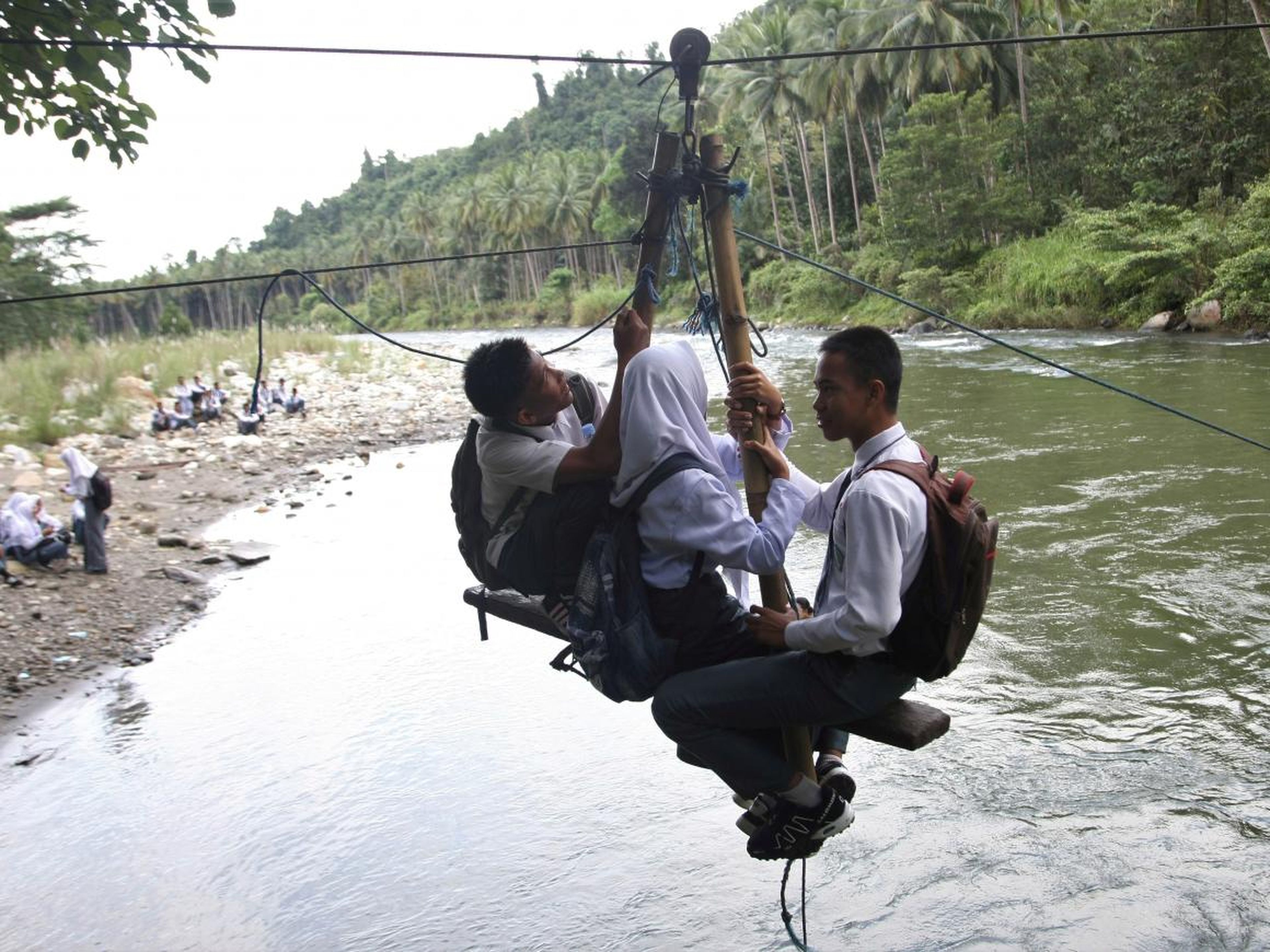 Sometimes the transportation is especially ingenious, like the seated zip line in the Indonesian town of Kolaka Utara. The seat can hold a maximum of four people.