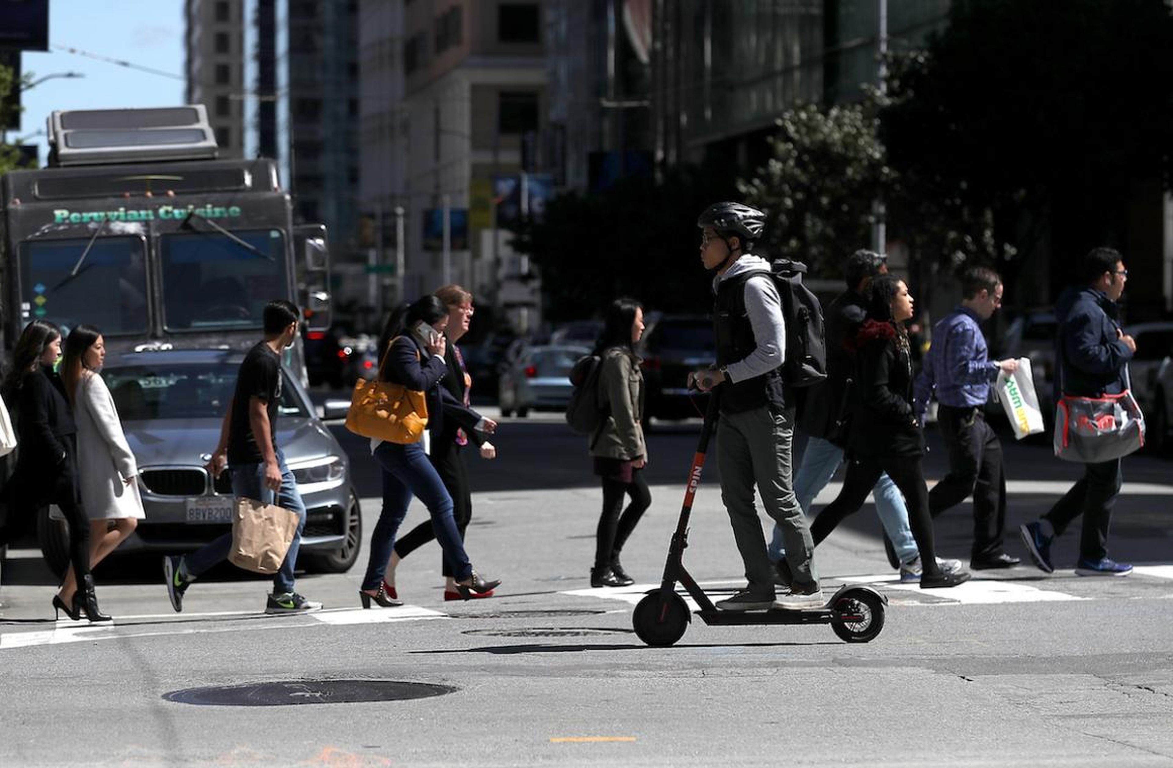 A user riding a Spin scooter on April 17 in San Francisco.