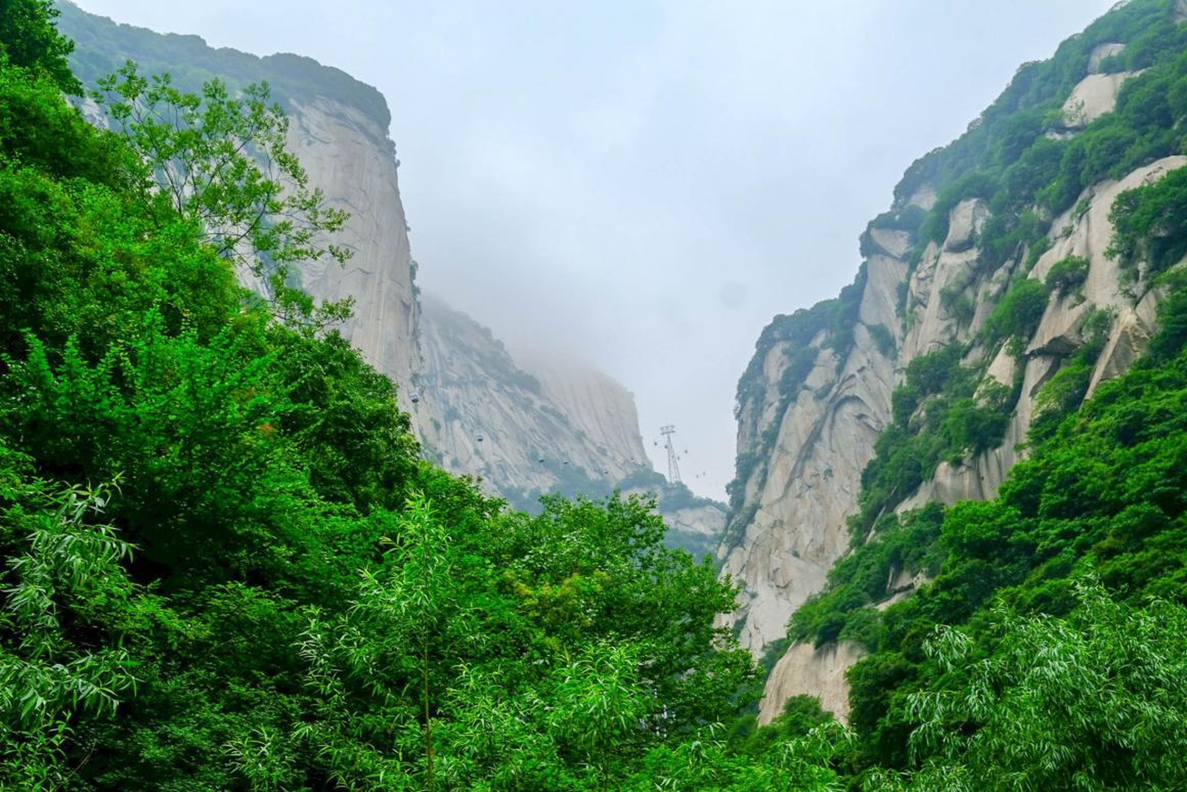 In China, I headed to Mount Hua, or Huashan, considered to be one of China's five sacred mountains and one of the most popular tourist attractions and pilgrimage sites for Chinese people. The mountain actually has five main peaks: