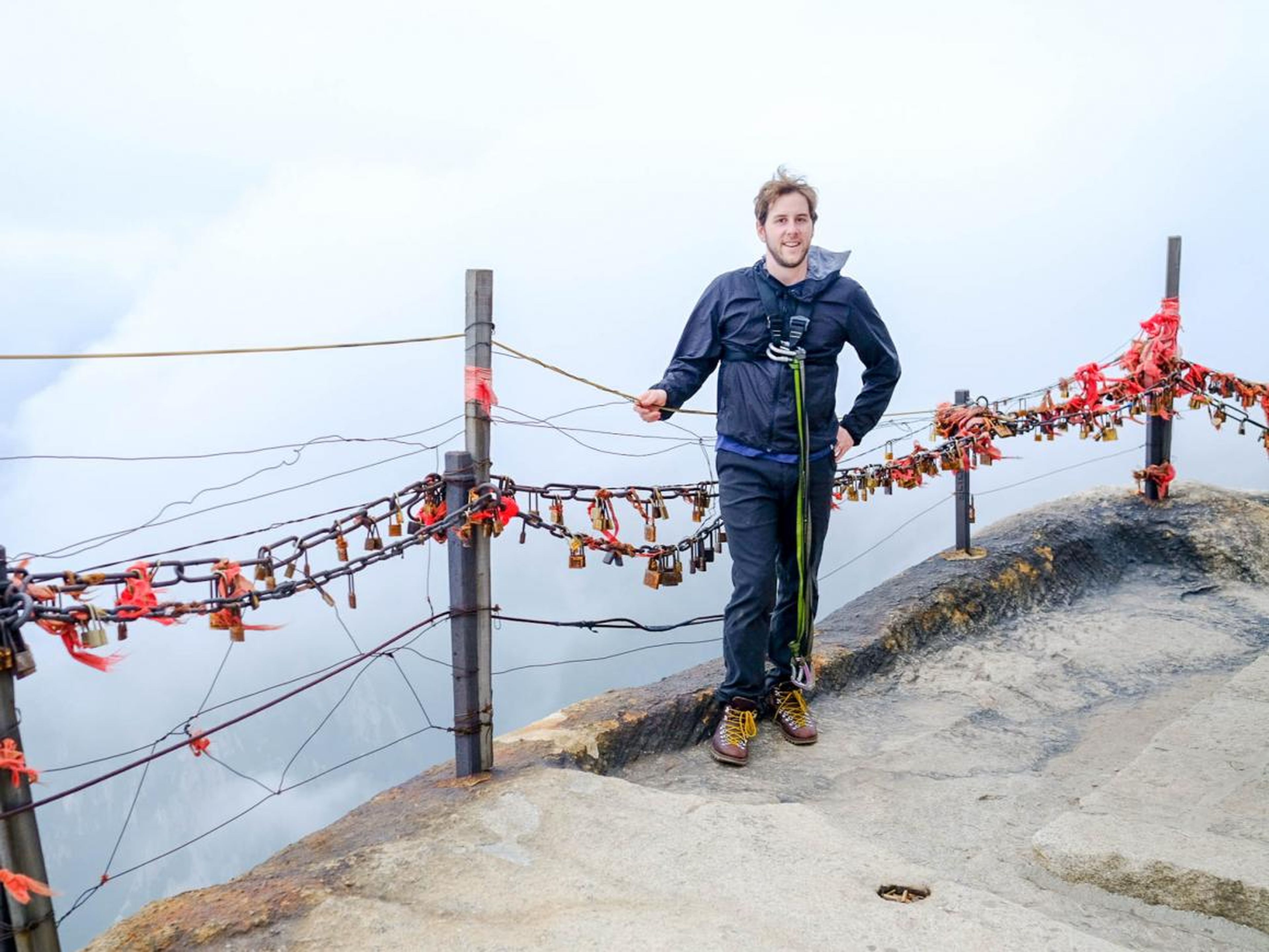 The author, approaching the Plank Walk on China's Mount Hua, which is considered by many to be one of the most dangerous hikes in the world.