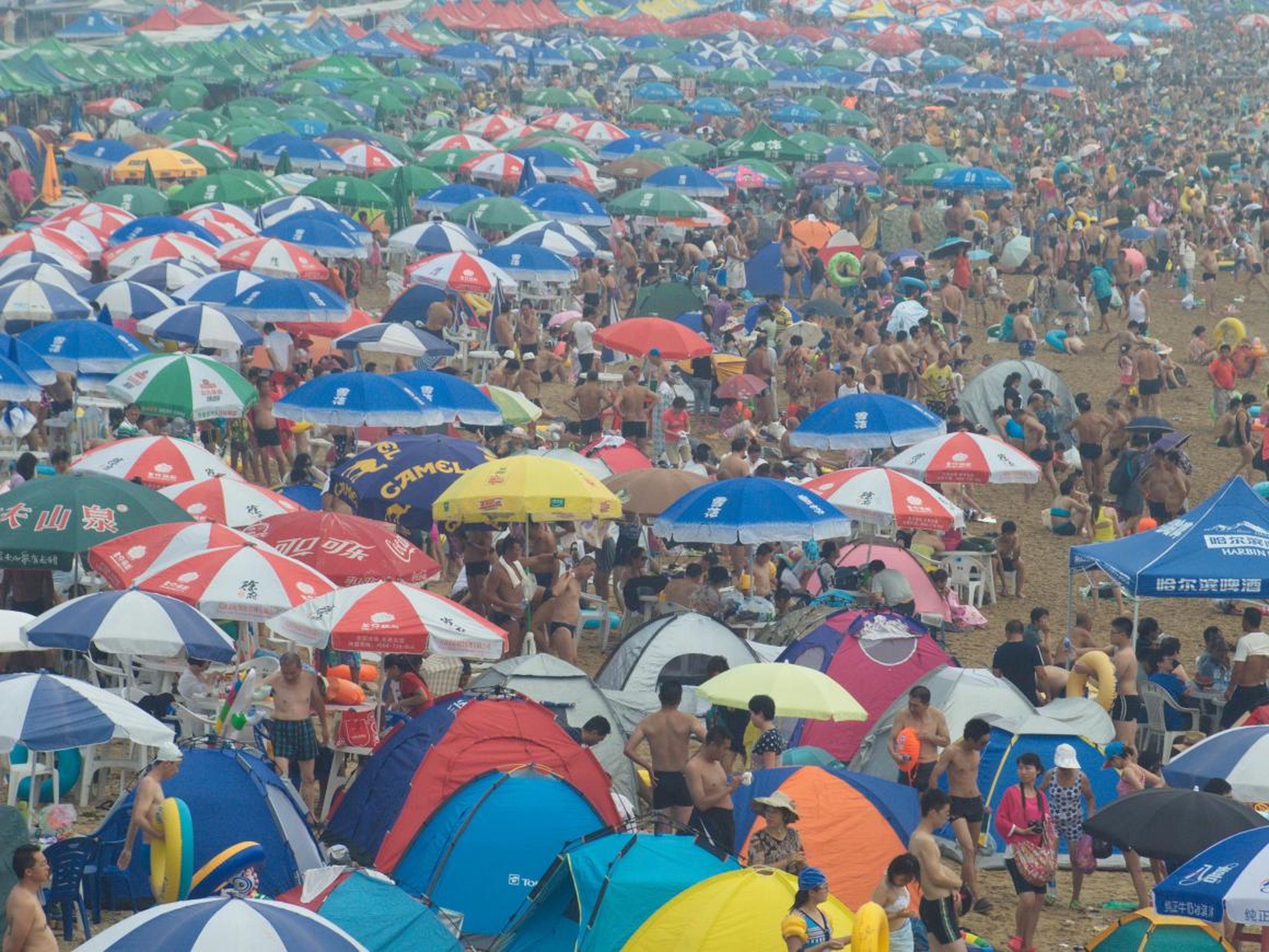 But beach vacationers will have to fight to get a spot, judging from photos such as this one from Fujiazhuang beach in Dalian on a nearly 90-degree day in 2015. "I went on a weekday and almost could only see the water through