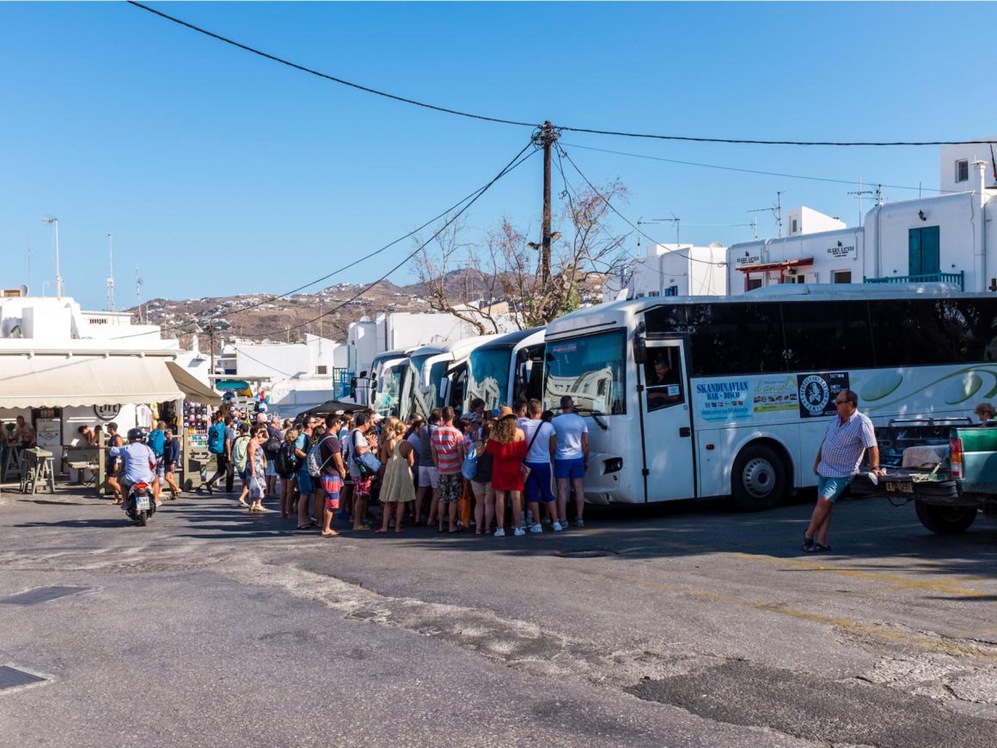 As far as getting around Mykonos, your best bet is the public bus system, which is convenient, cheap, and just about your only option. Taxis are impossible on the island. You can rent a car or a bike, but be aware, the island is