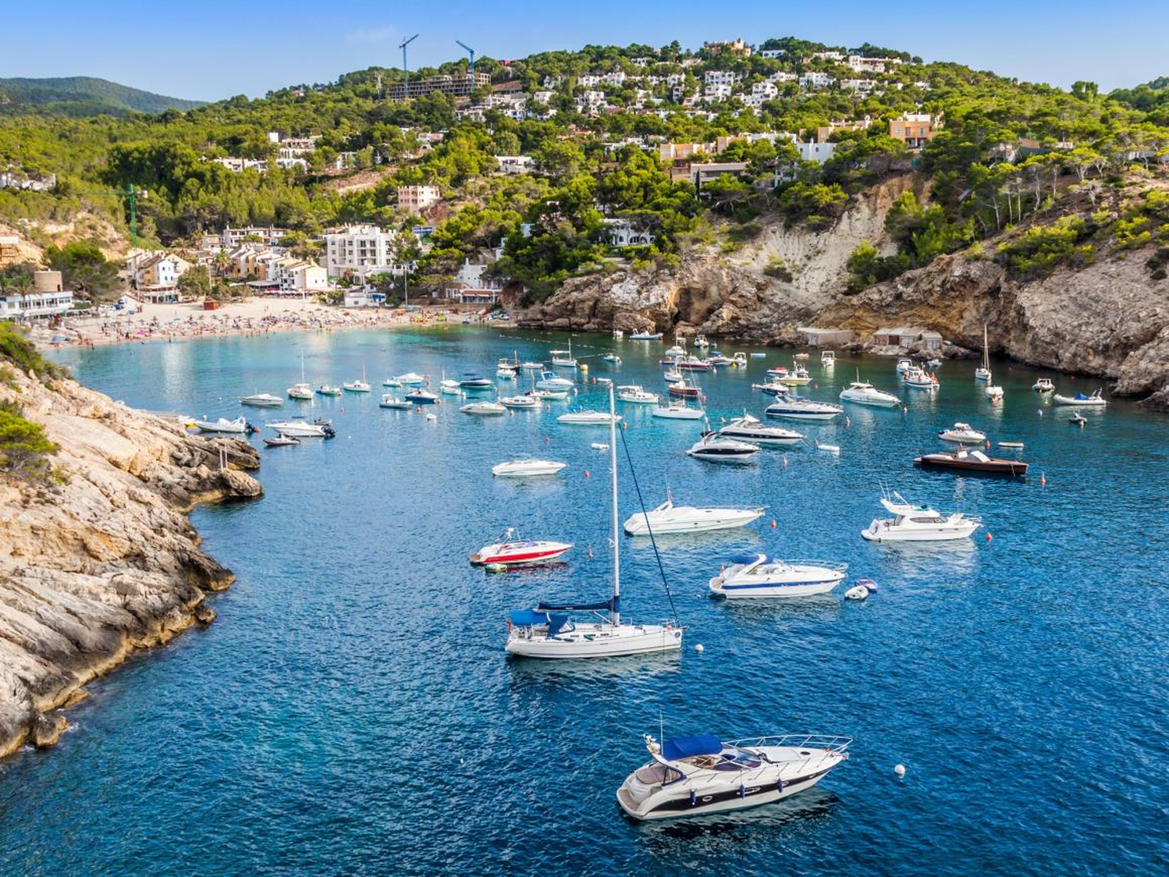Located in the Balearic Islands of Spain and around 220 square miles, Ibiza is known both for its swanky beach hotels and villas frequented by the wealthy and famous and for its thumping nonstop clubbing scene.