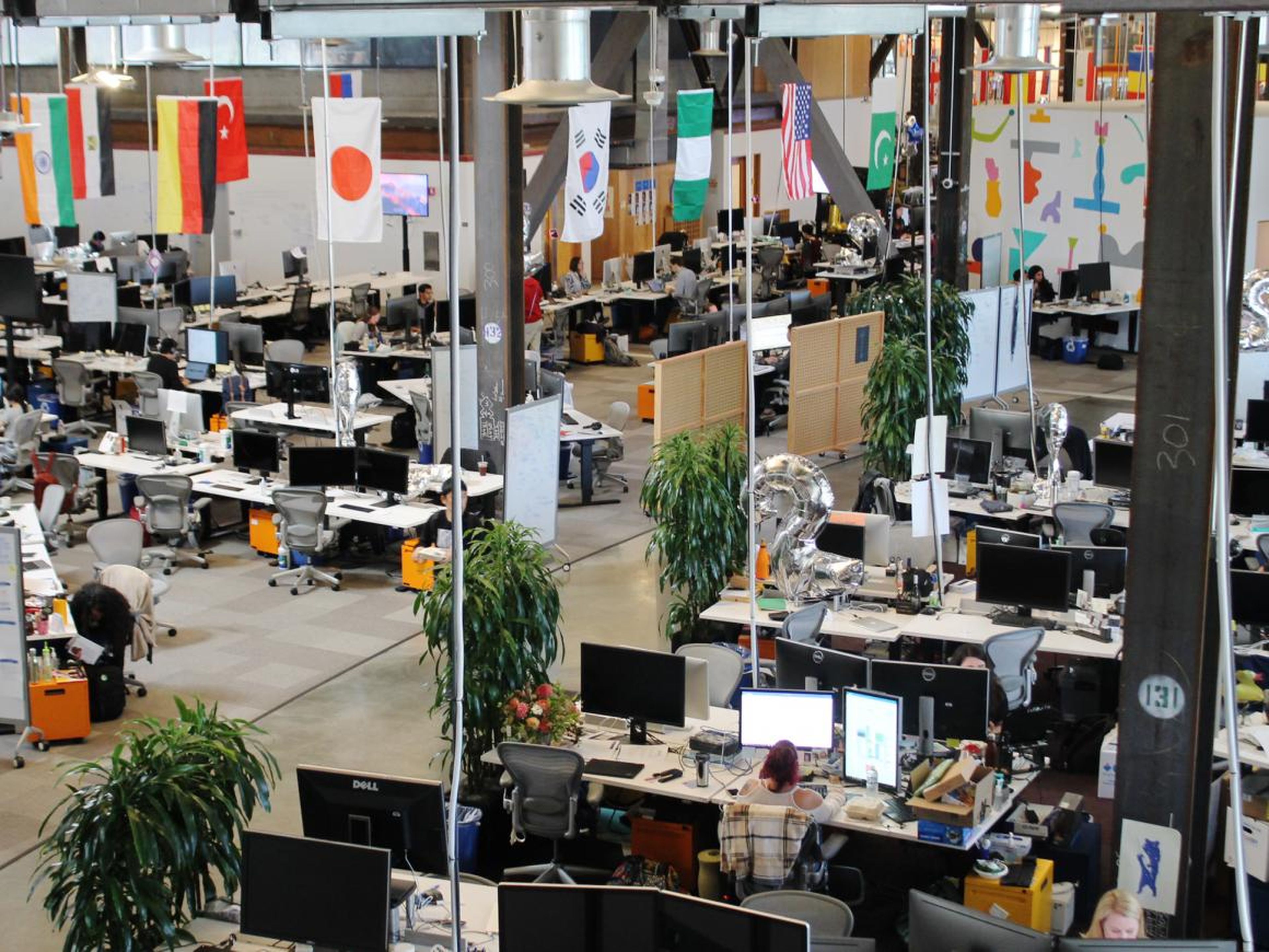 Flags hang above the Growth team's desks at Facebook offices.