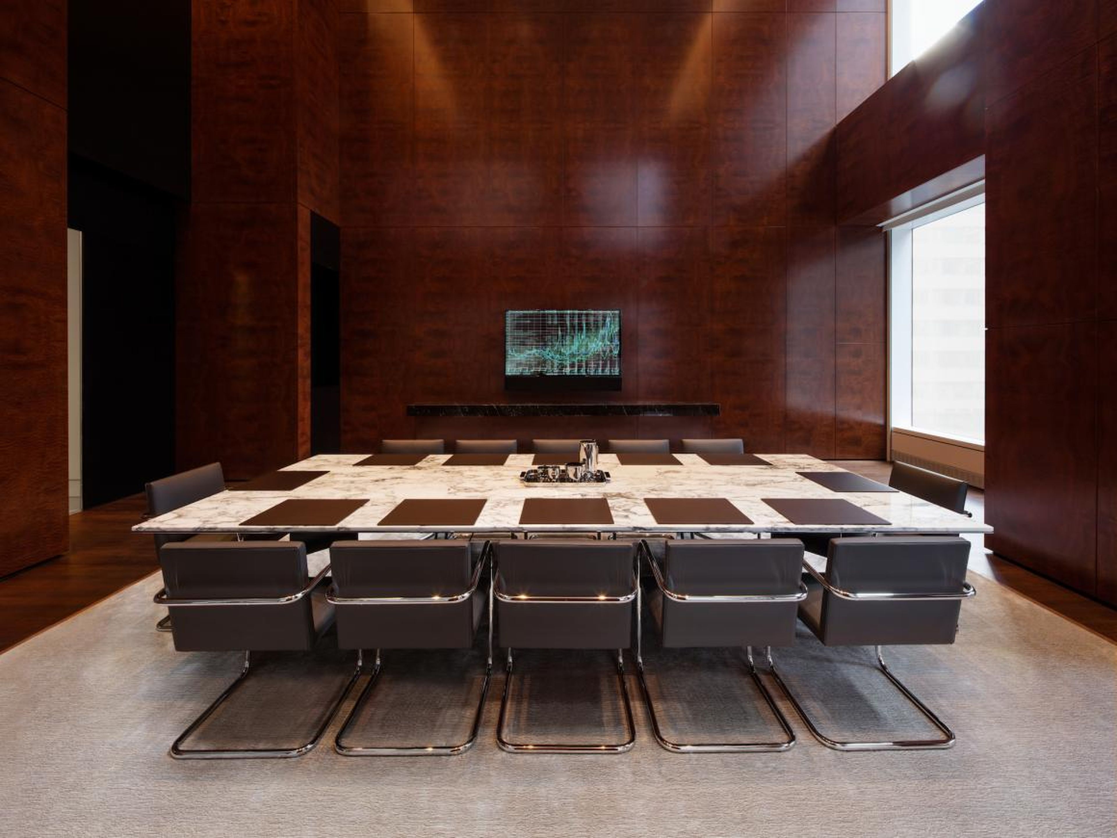 ... a conference room with a marble table that seats 14 ...