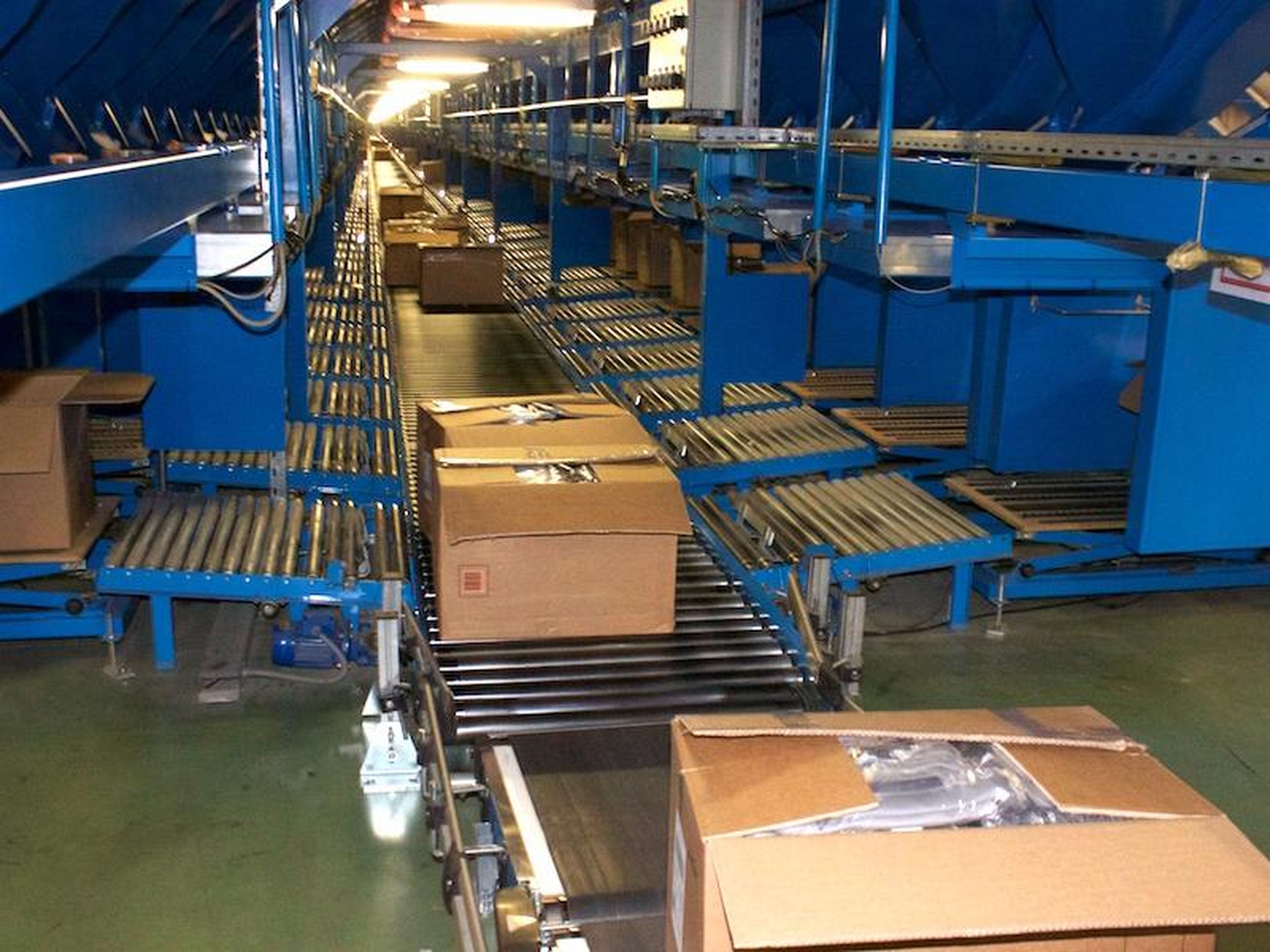 The full boxes are then placed on another conveyer belt to be sent out for delivery.