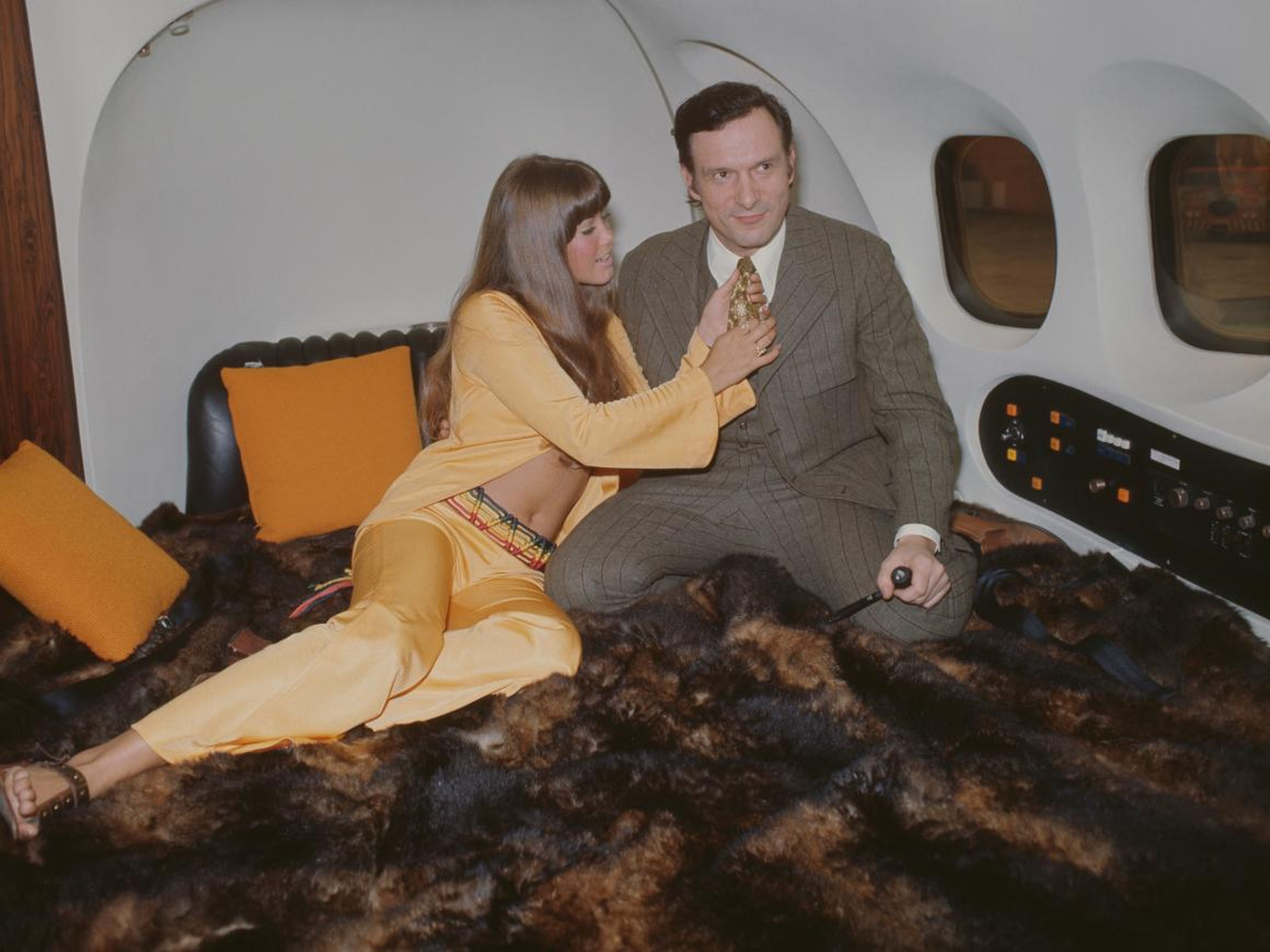 Hefner and his girlfriend Barbi Benton on board "Big Bunny" at London Airport in 1970.