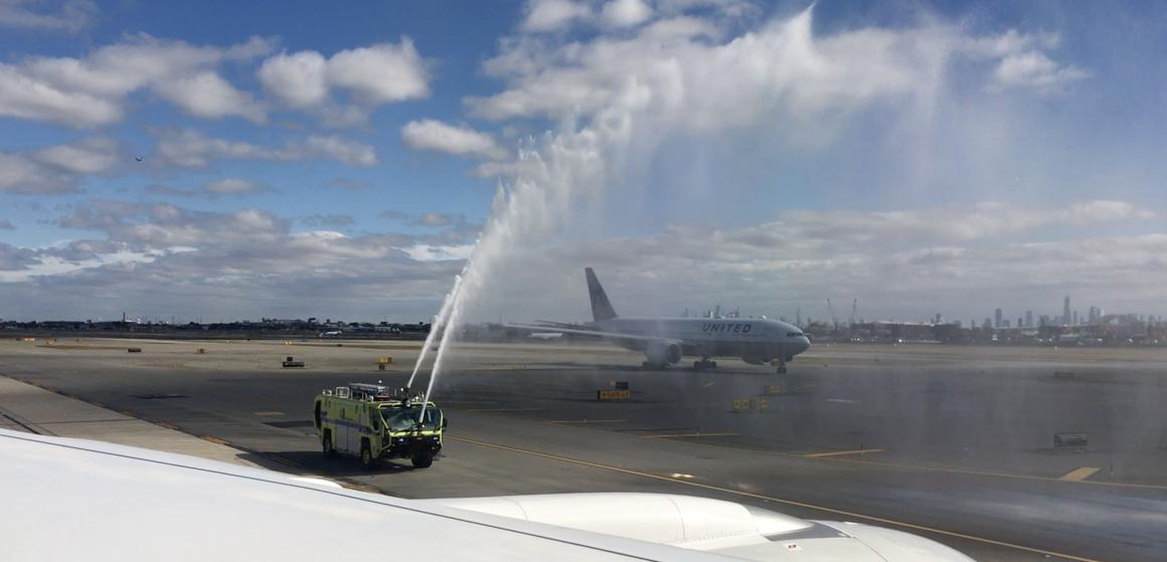 Next, fire trucks commemorated the special occasion with a water-cannon salute.