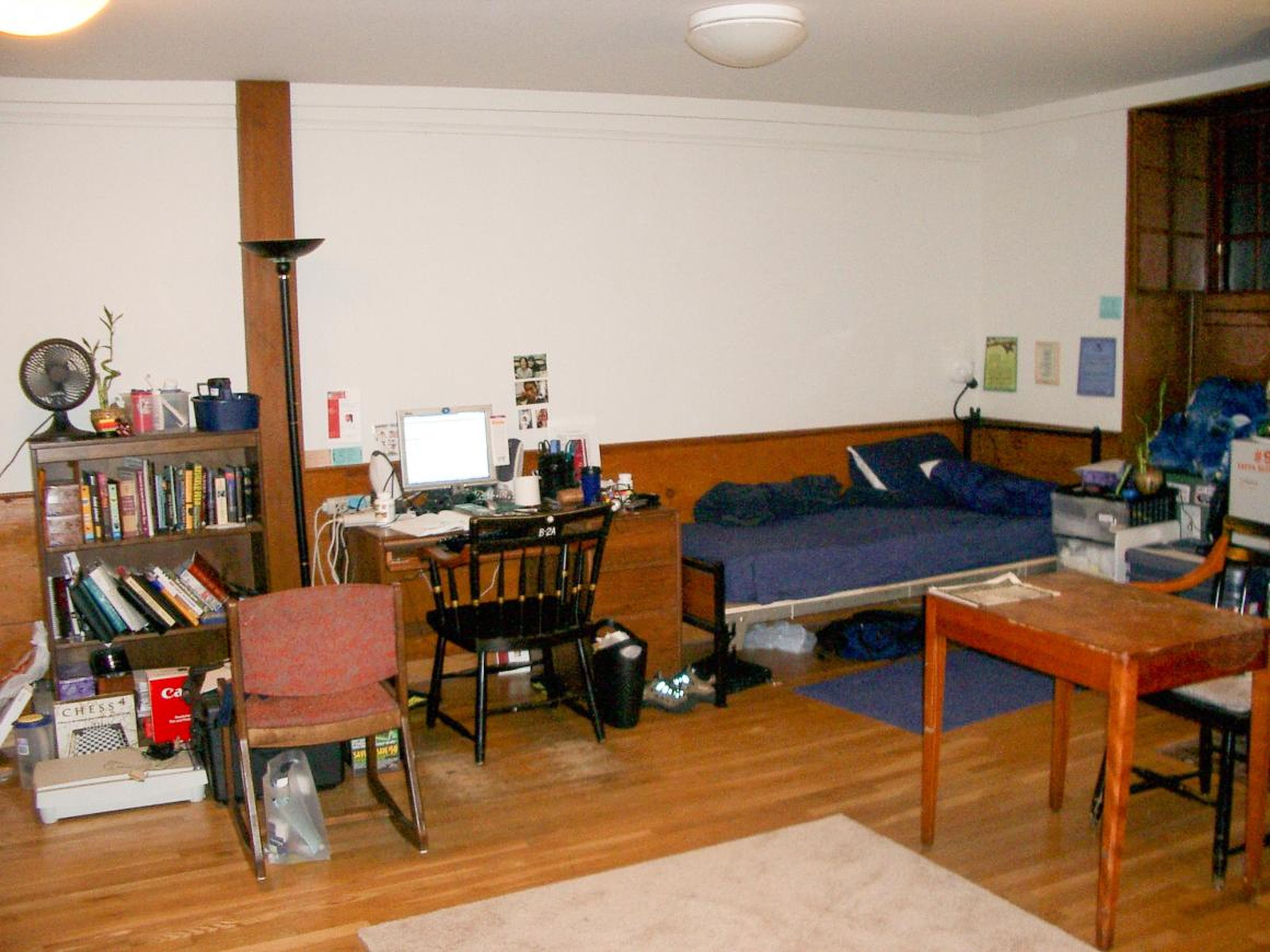 Other dormitories, like the first-year house of Stoughton, feature a large single room layout with two beds.