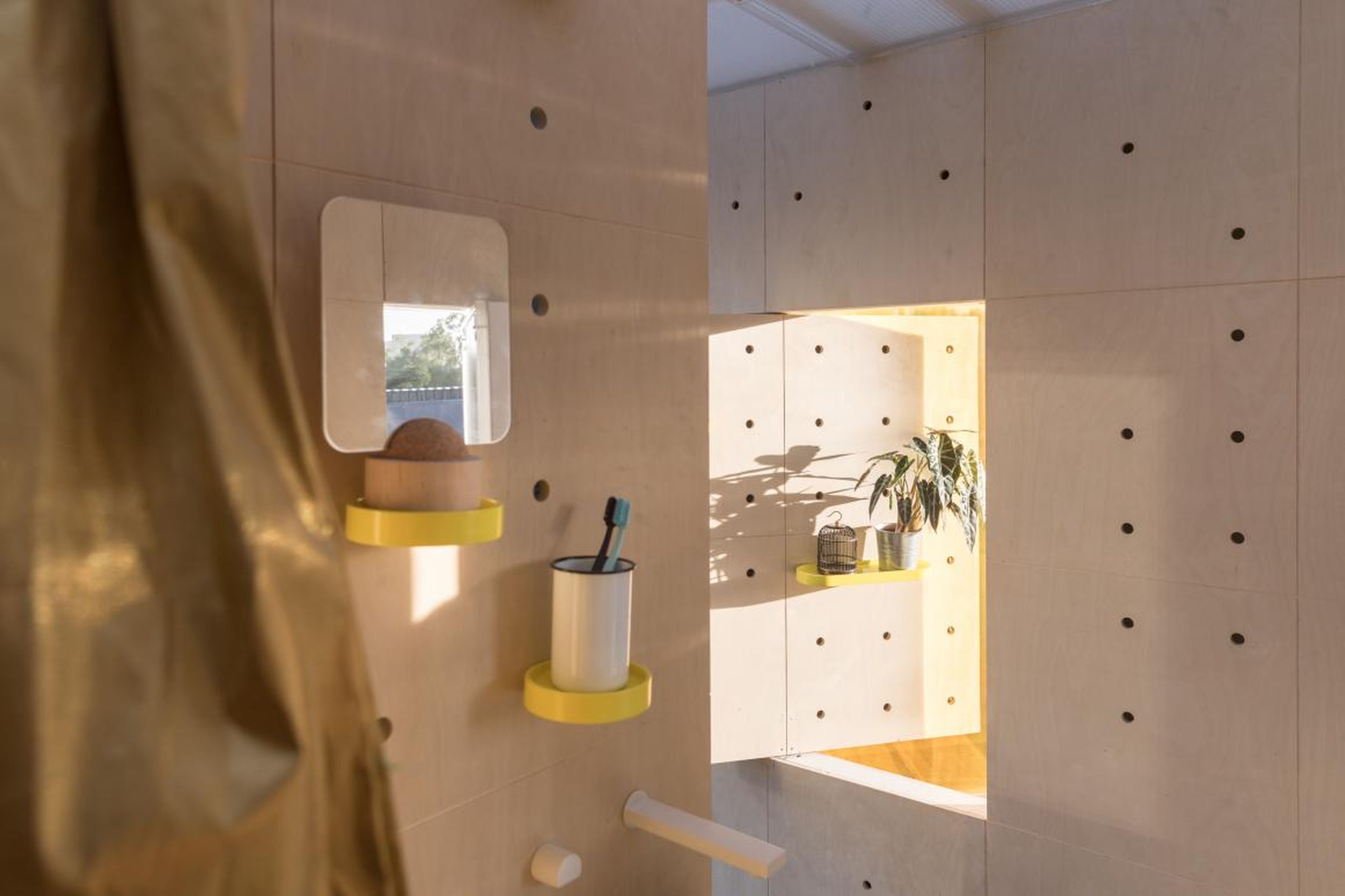Pegboard walls allow residents to customize their shelf space.