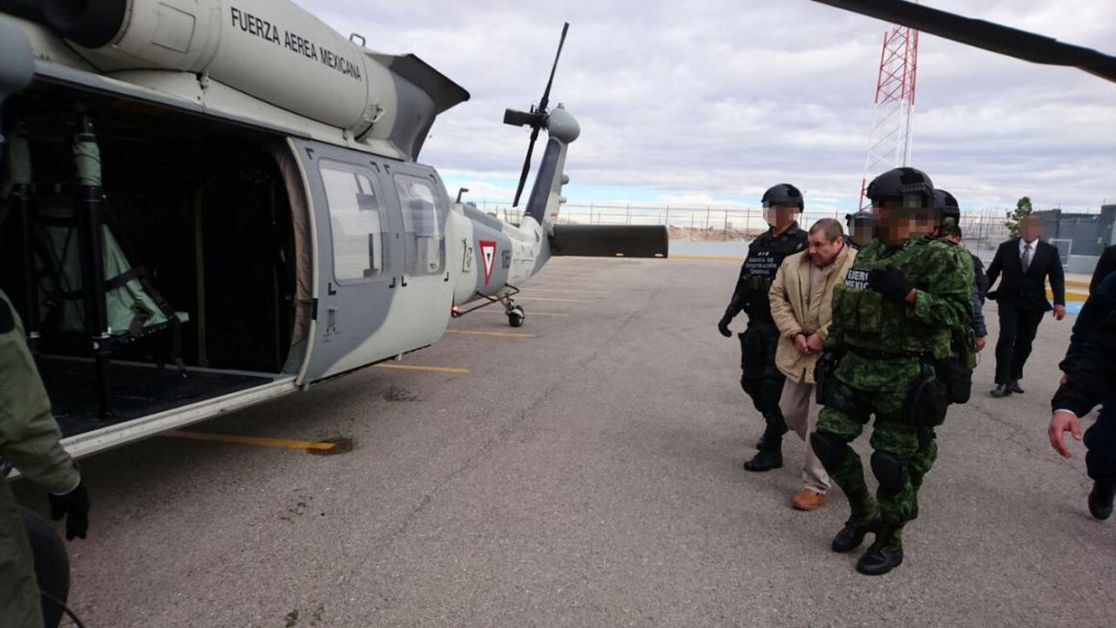 Guzman is escorted to a helicopter by soldiers during his extradition in Ciudad Juarez, Mexico, on January 19, 2017.