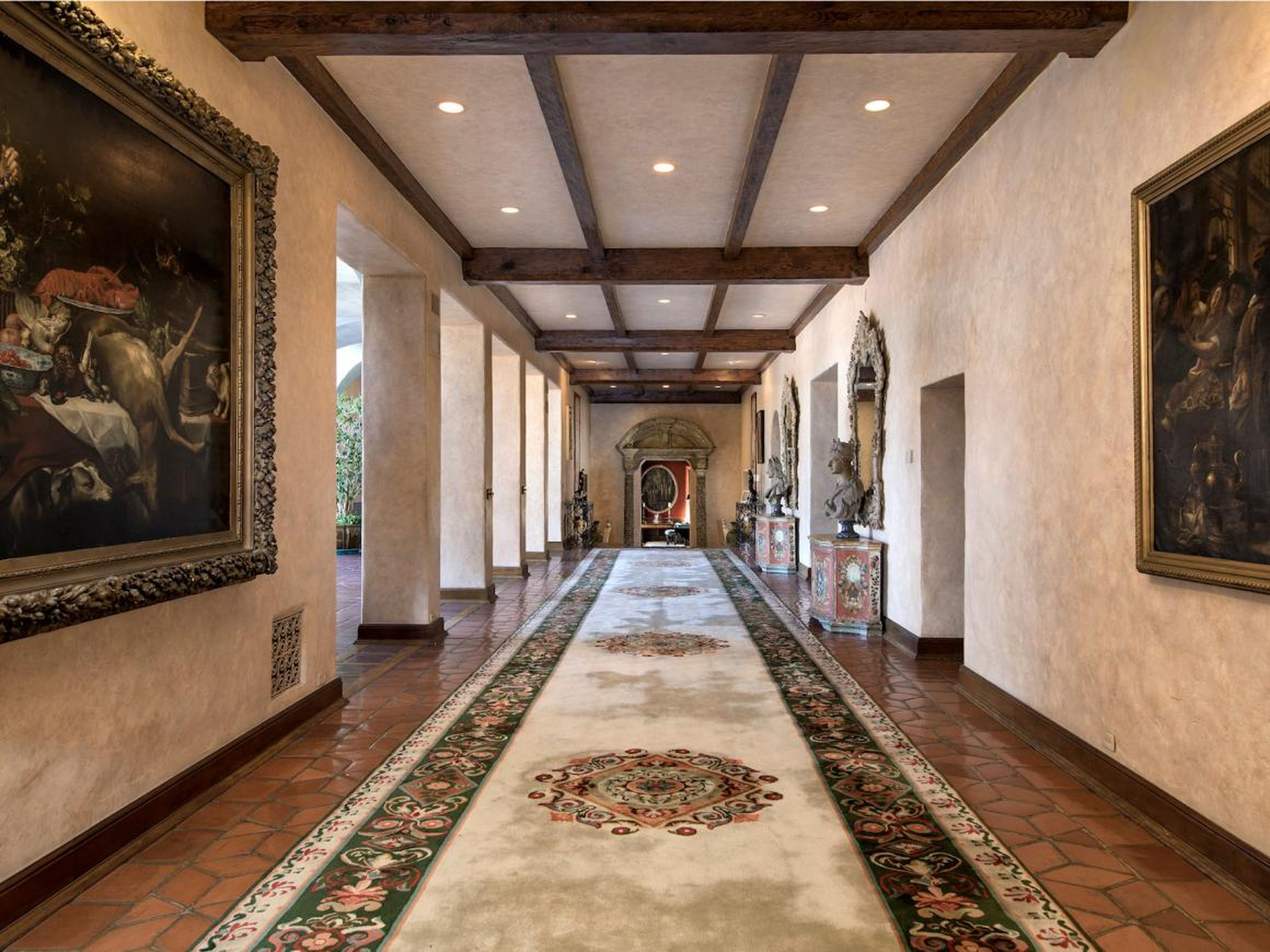 A stroll through the house would take you through its grand hallways, one of which is 82 feet long and the other more than 102 feet with a 40-foot wide mural.