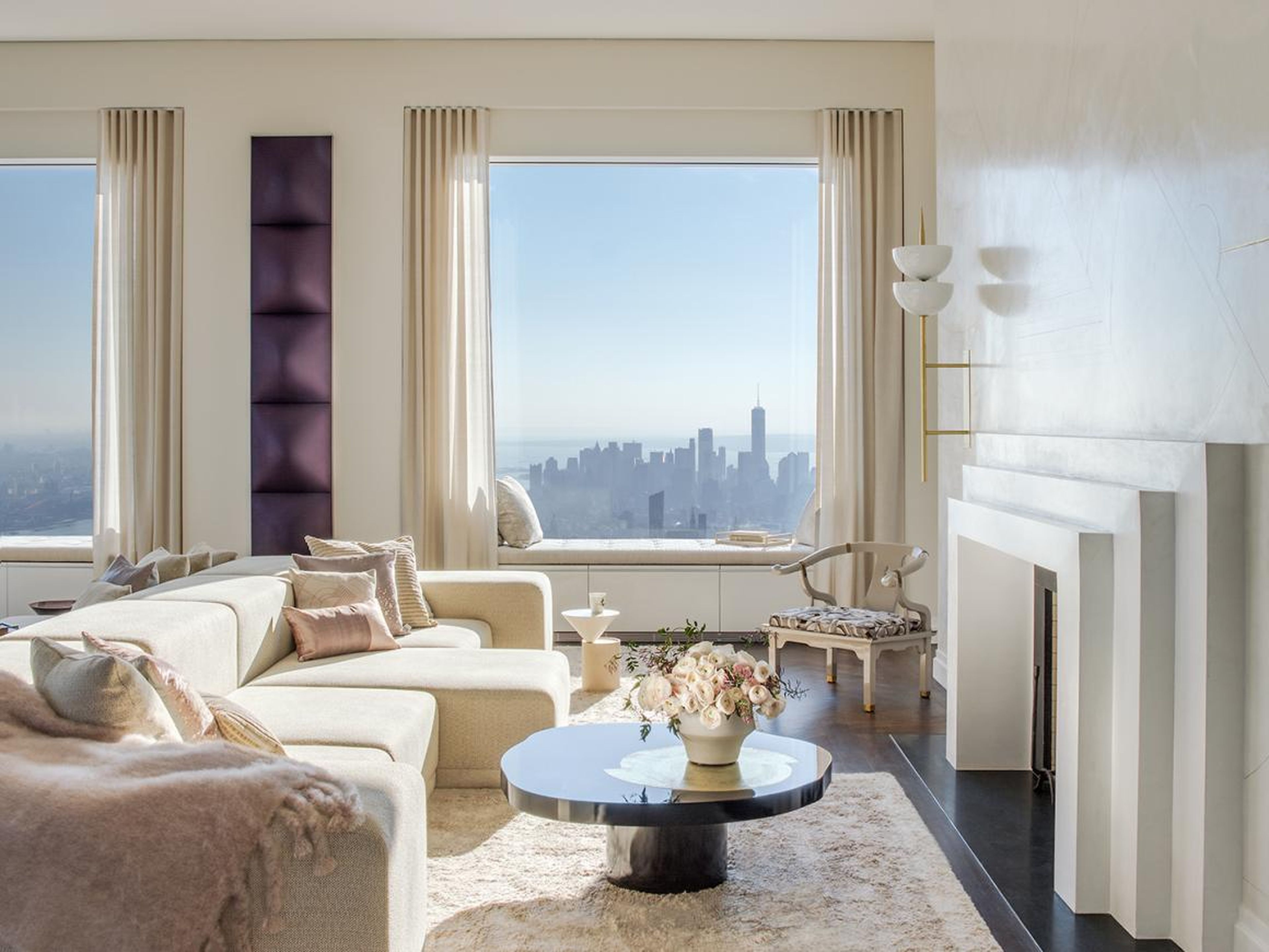 The floor, accessed by a private elevator, offers panoramic views of the city and Central Park.