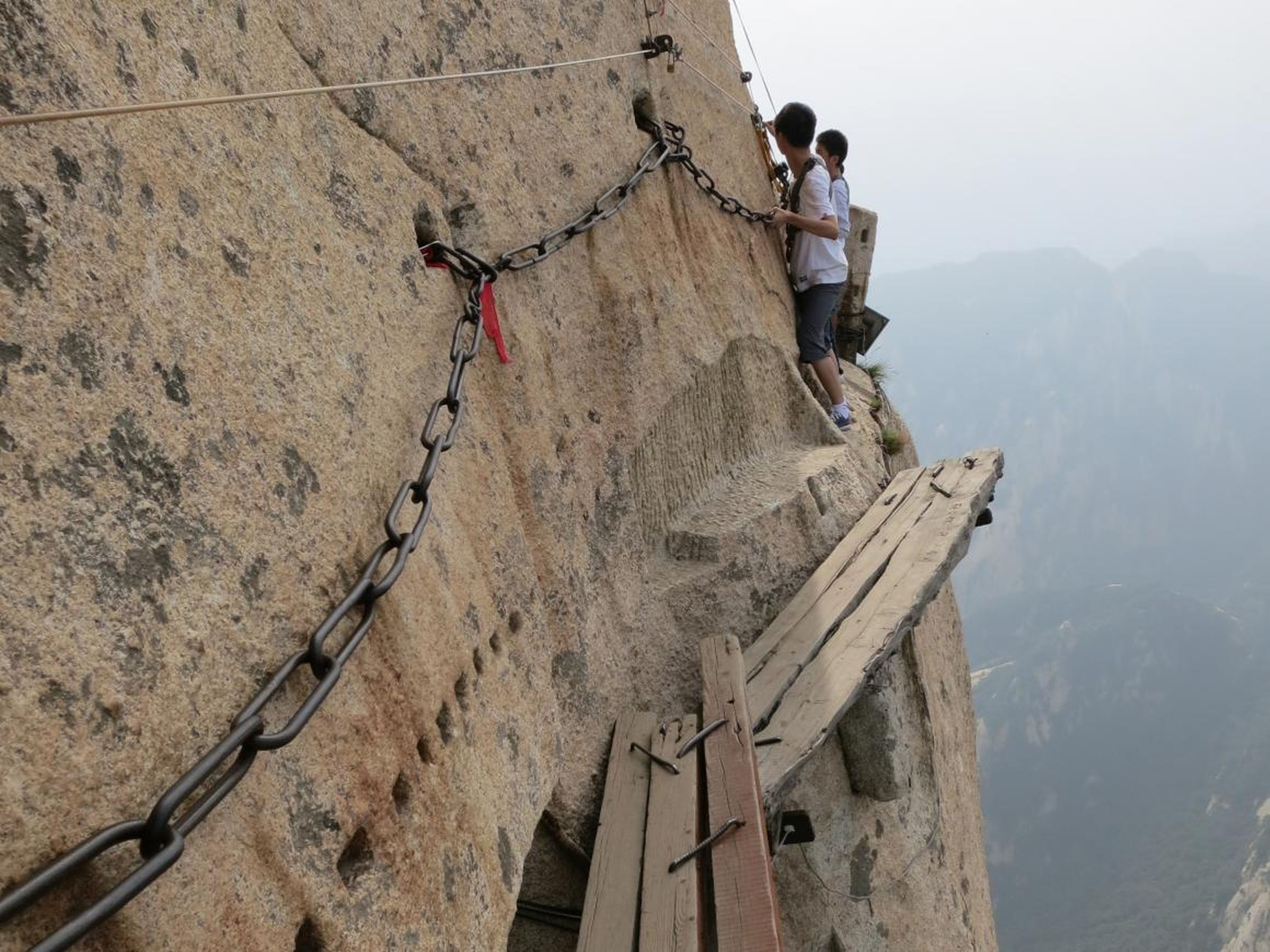 While breathtaking, it's considered to be one of the world's most dangerous places to hike, due in large part to the infamous plank walk located on the mountain's highest peak, South, which has a height of 7,070 feet.
