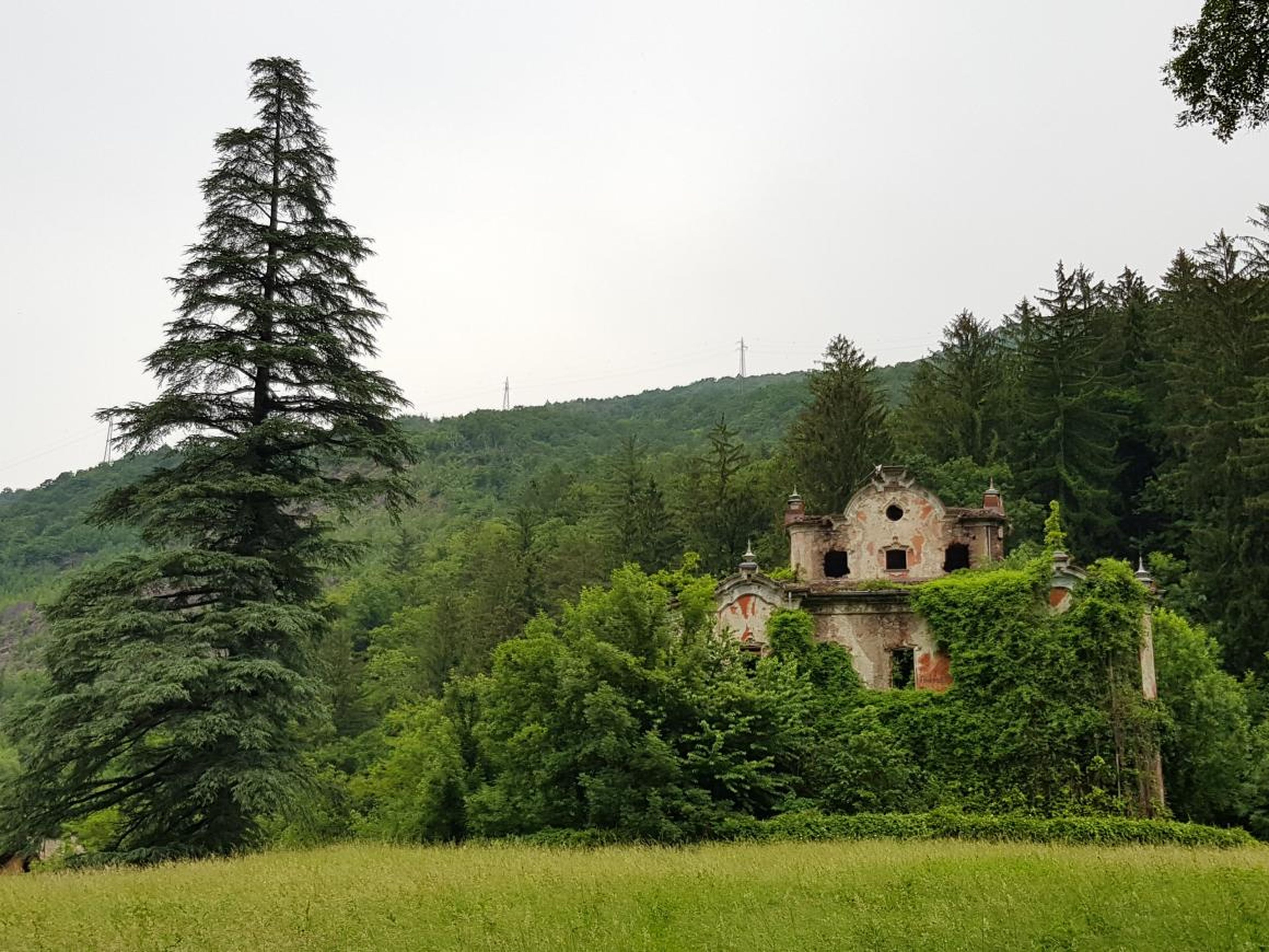 A 2002 avalanche destroyed nearby homes, but the once-lavish and now battered "Ghost Mansion" remains standing.
