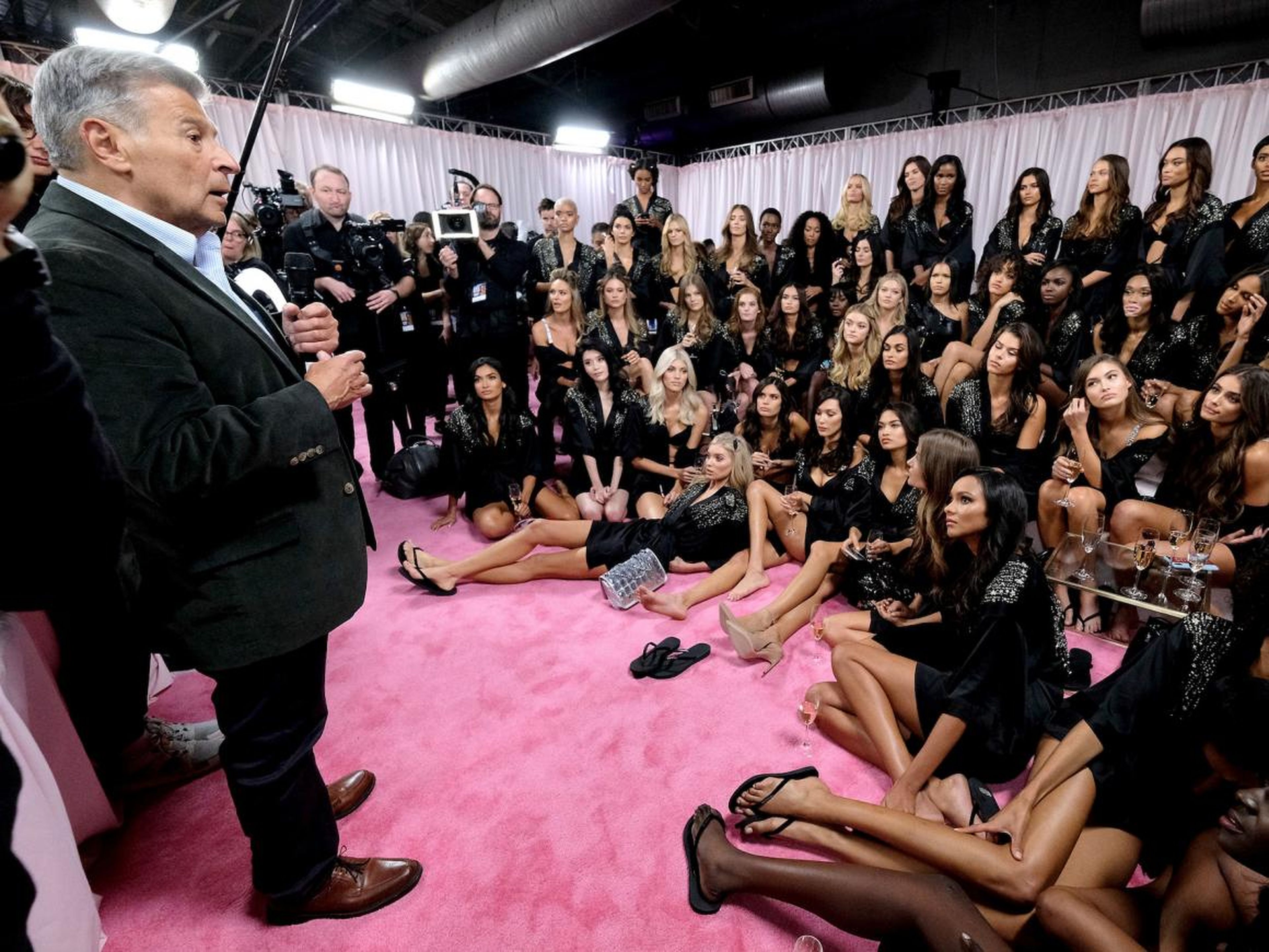 Ed Razek speaks to the 2018 Victoria's Secret runway models backstage during the 2018 Victoria's Secret Fashion Show at Pier 94 on November 8, 2018 in New York City.