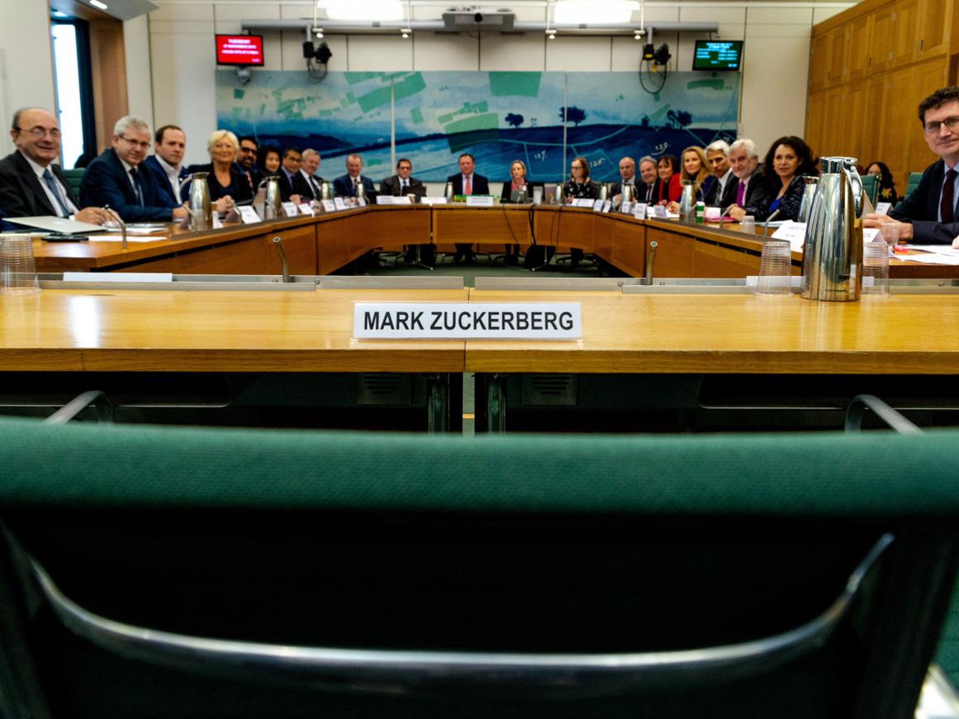 The committee left an empty chair for Zuckerberg.