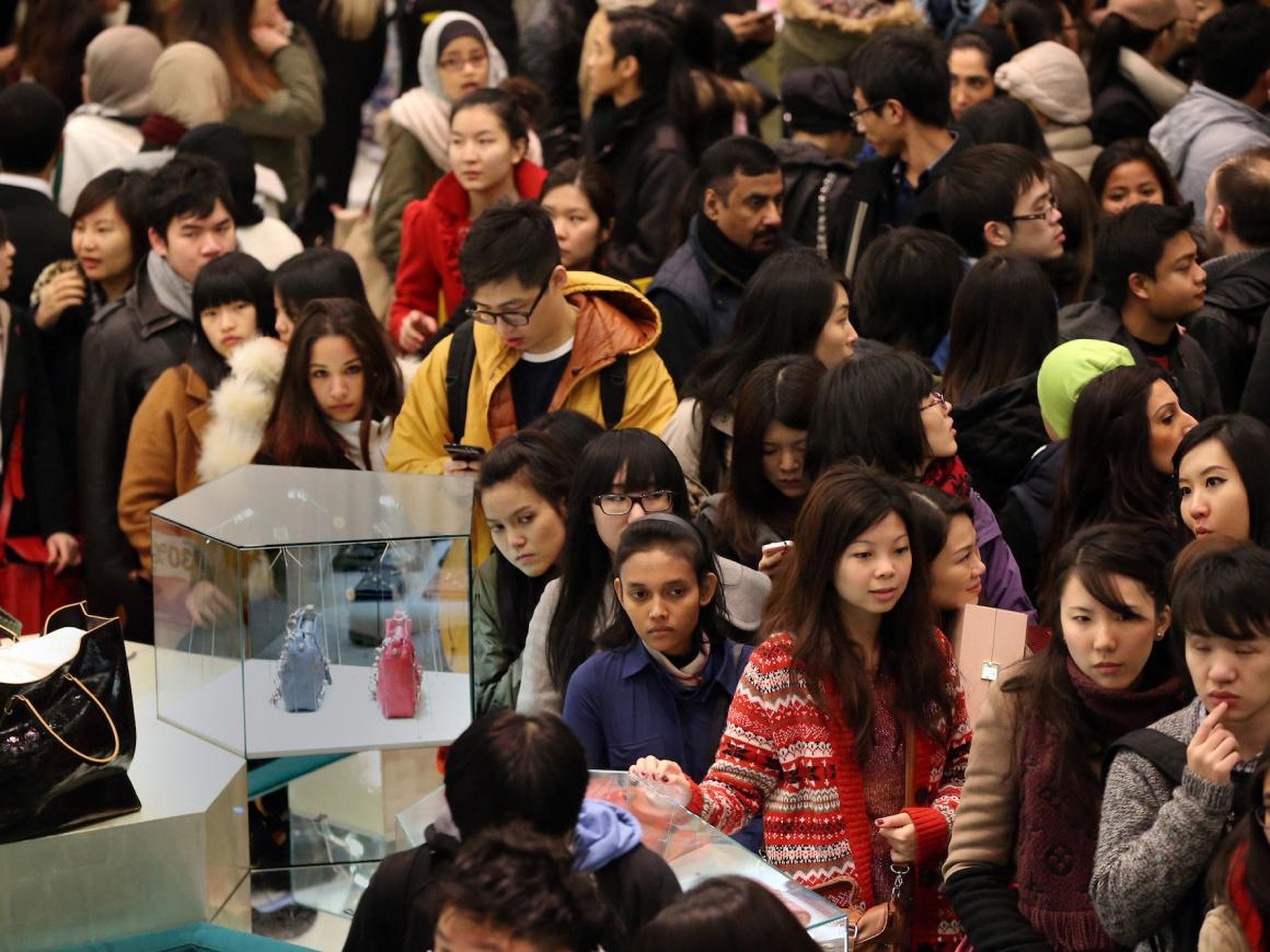 Millions of shoppers spill into stores, such as department stores in London, in hopes of finding bargains.