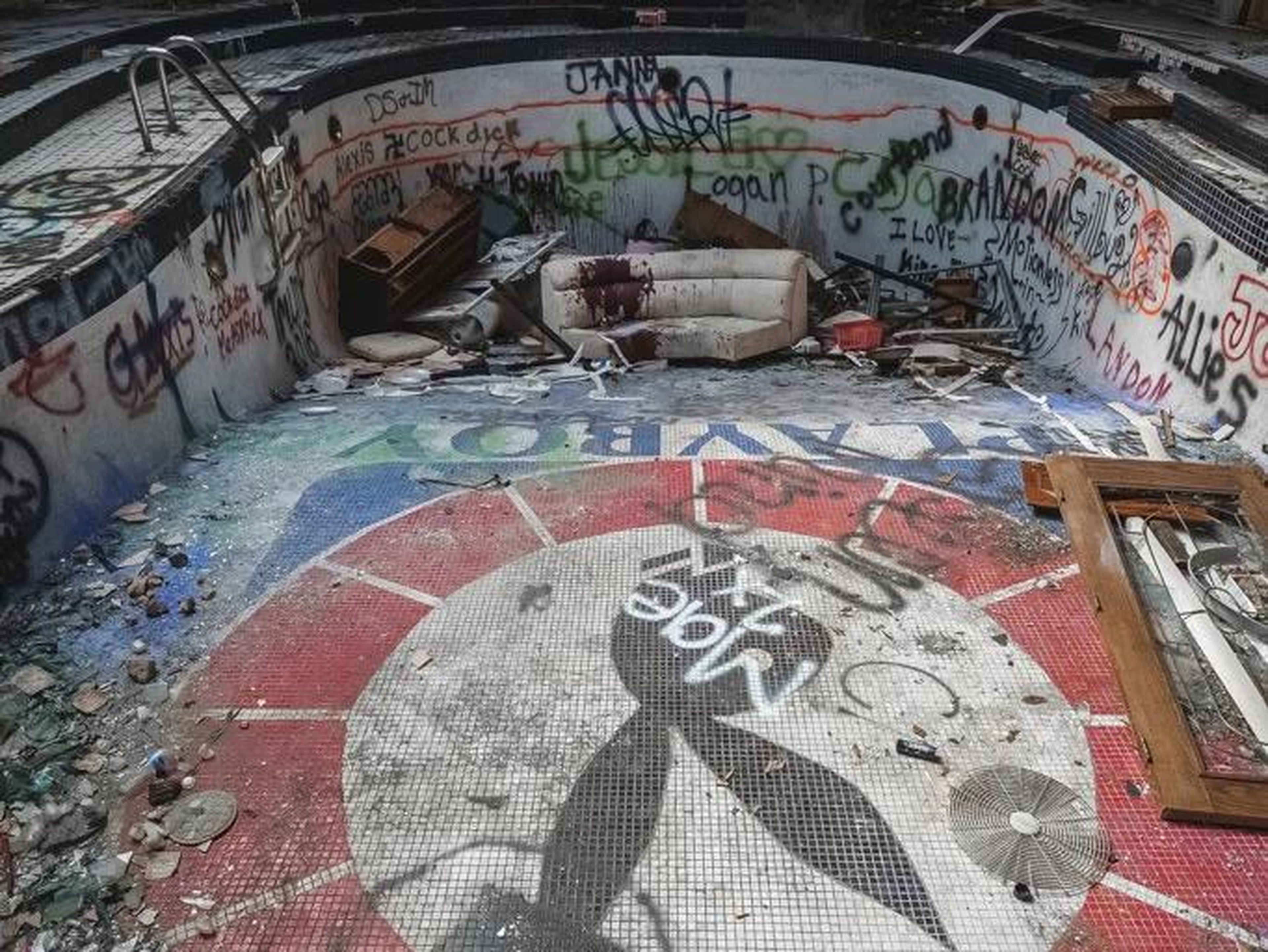 The owner got 20 years in prison, and the mansion, including an empty pool, is also now home to graffiti.