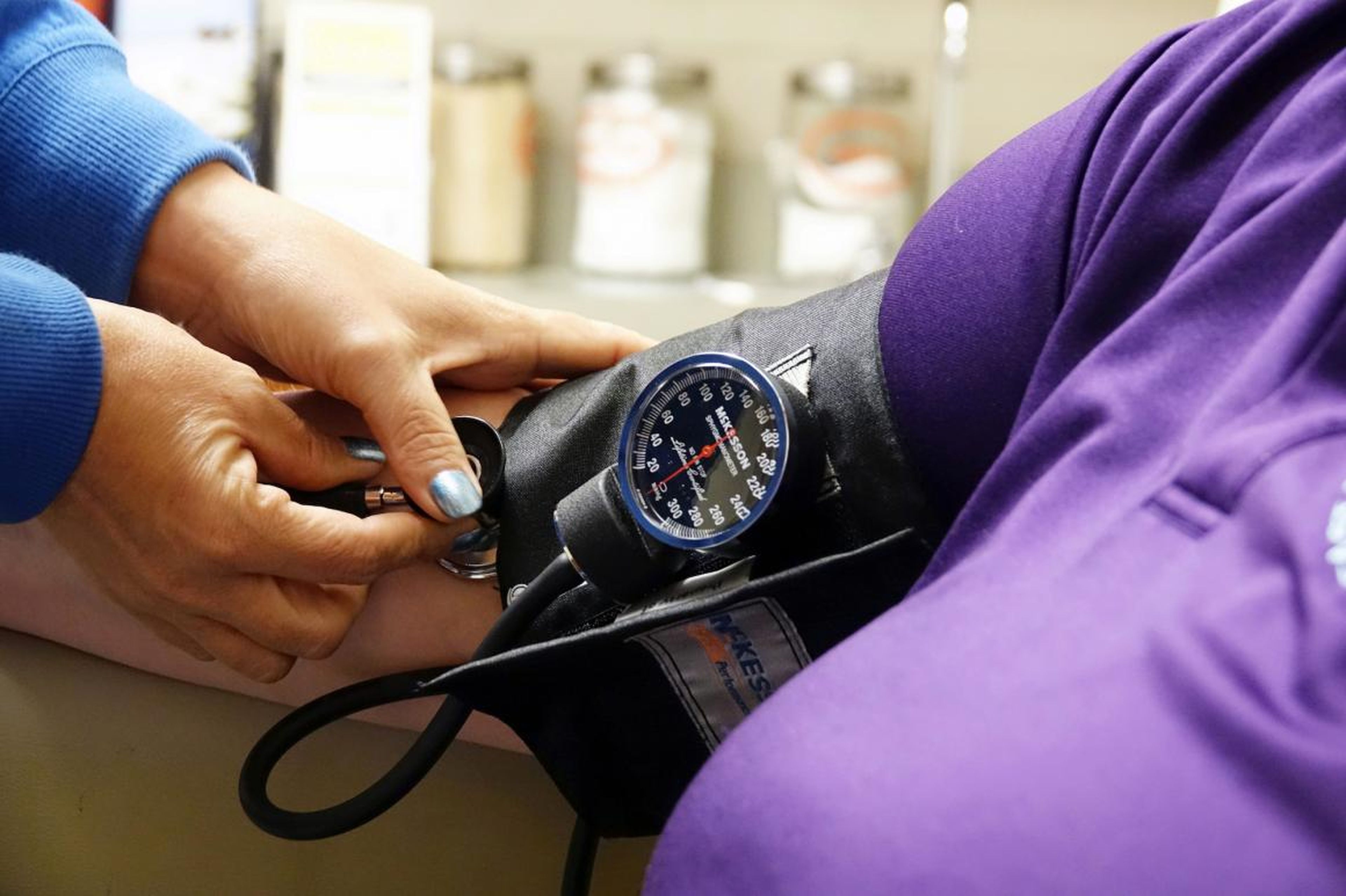 A patient undergoes a blood pressure test.