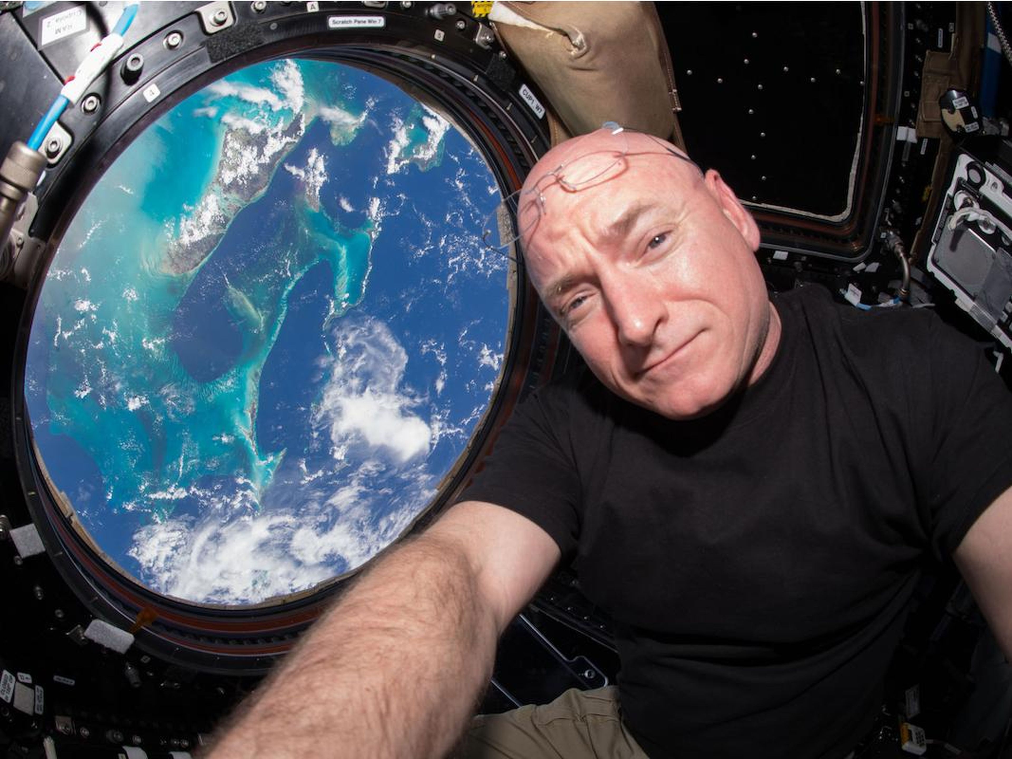 Scott Kelly snaps a selfie from the Earth-viewing Cupola module on the International Space Station.
