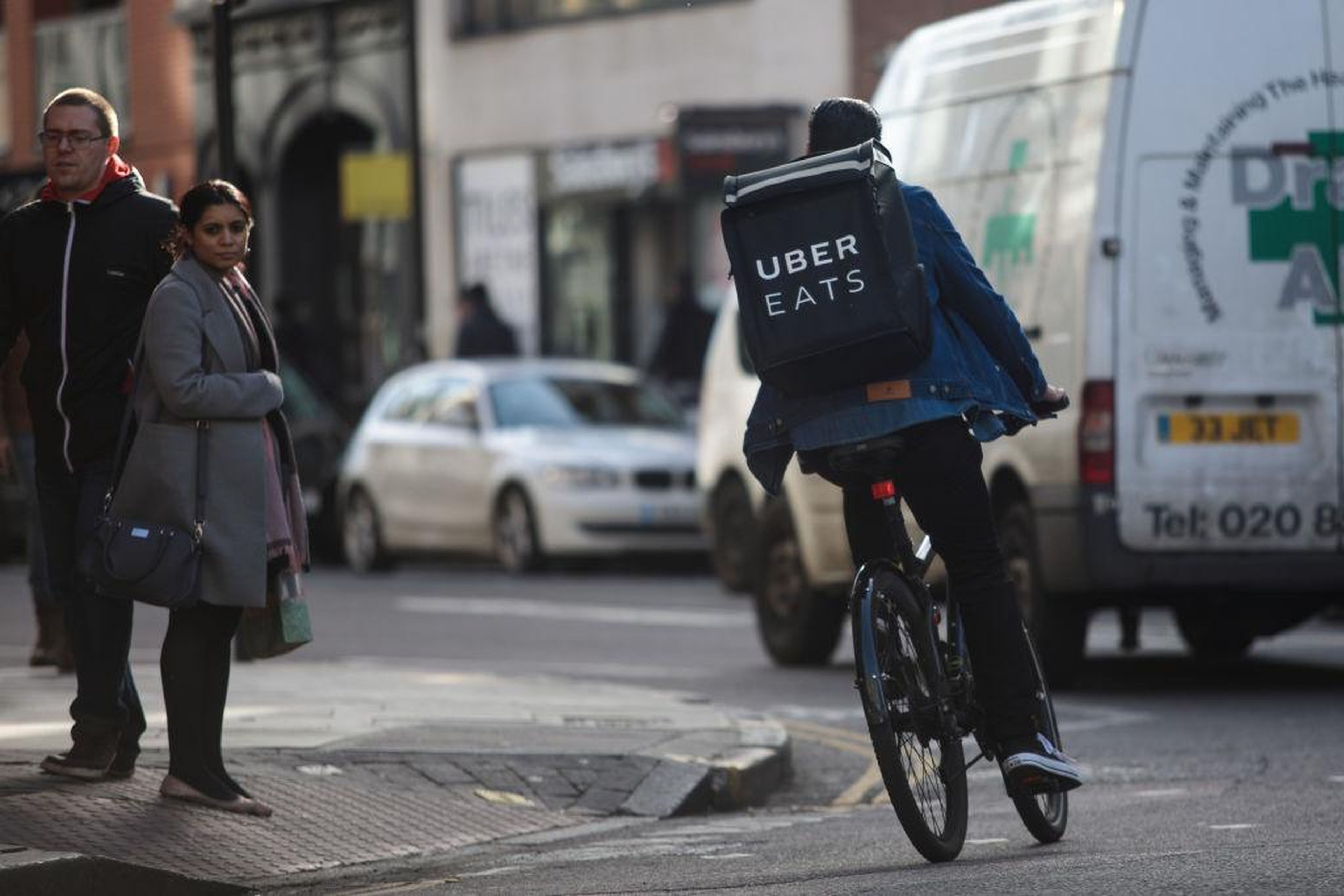 An Uber Eats rider cycles through central London.