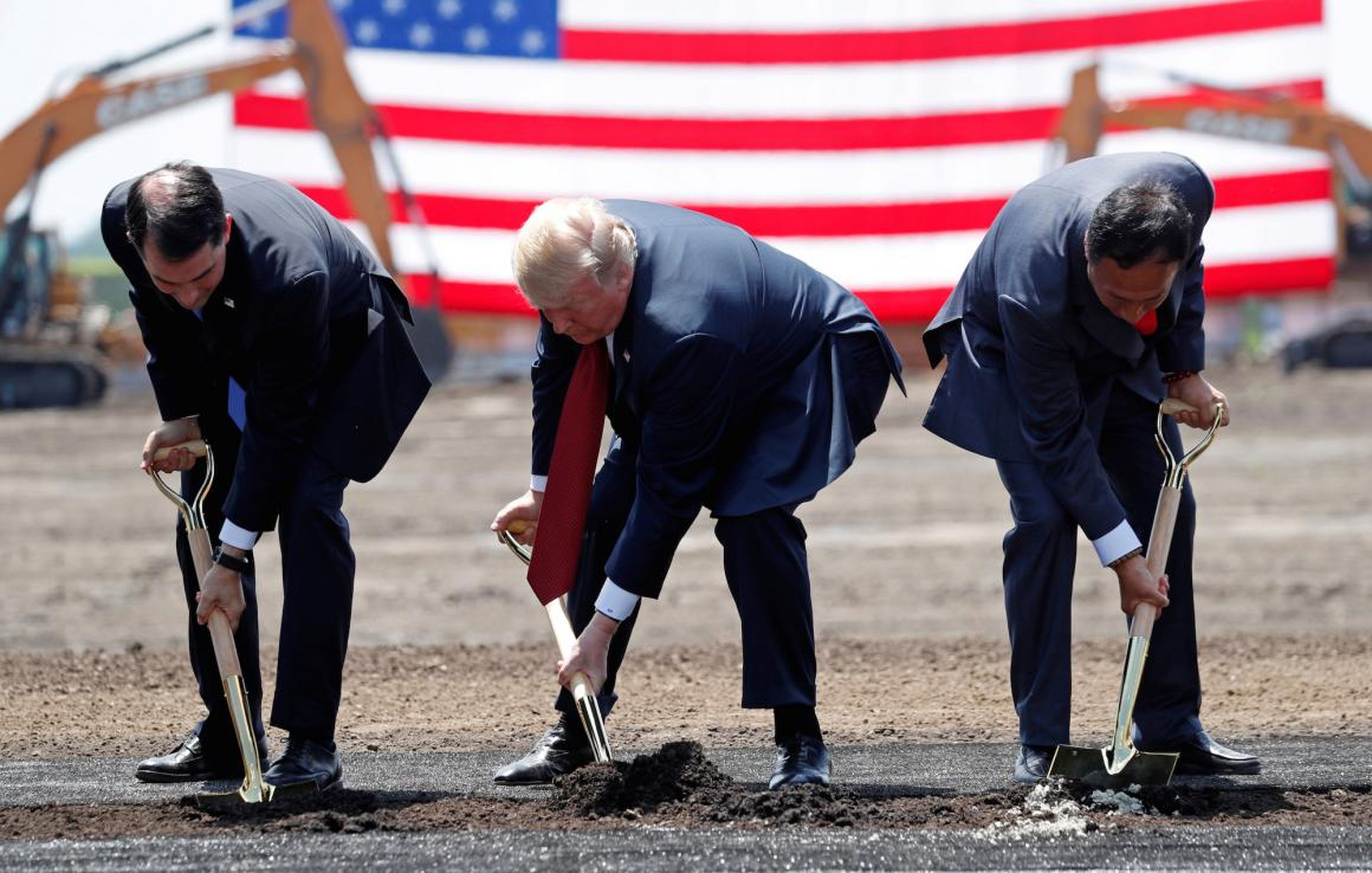 President Donald Trump taking part in a groundbreaking with Gov. Scott Walker of Wisconsin and Foxconn’s chairman, Terry Gou, during a visit to Foxconn's new site in Mount Pleasant, Wisconsin.