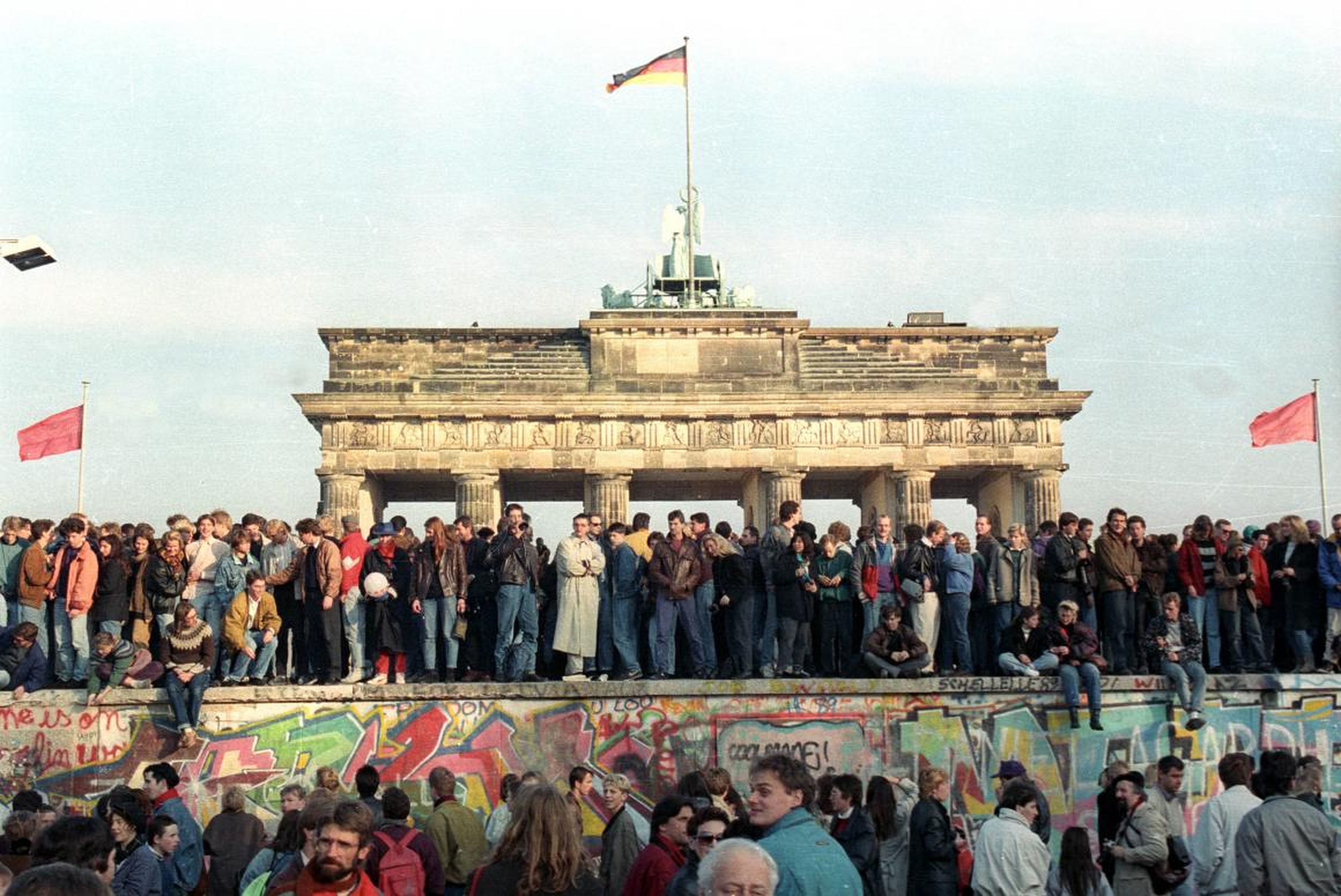 West Berlin citizens continued to stand atop the Berlin Wall at the Brandenburg Gate November 10.