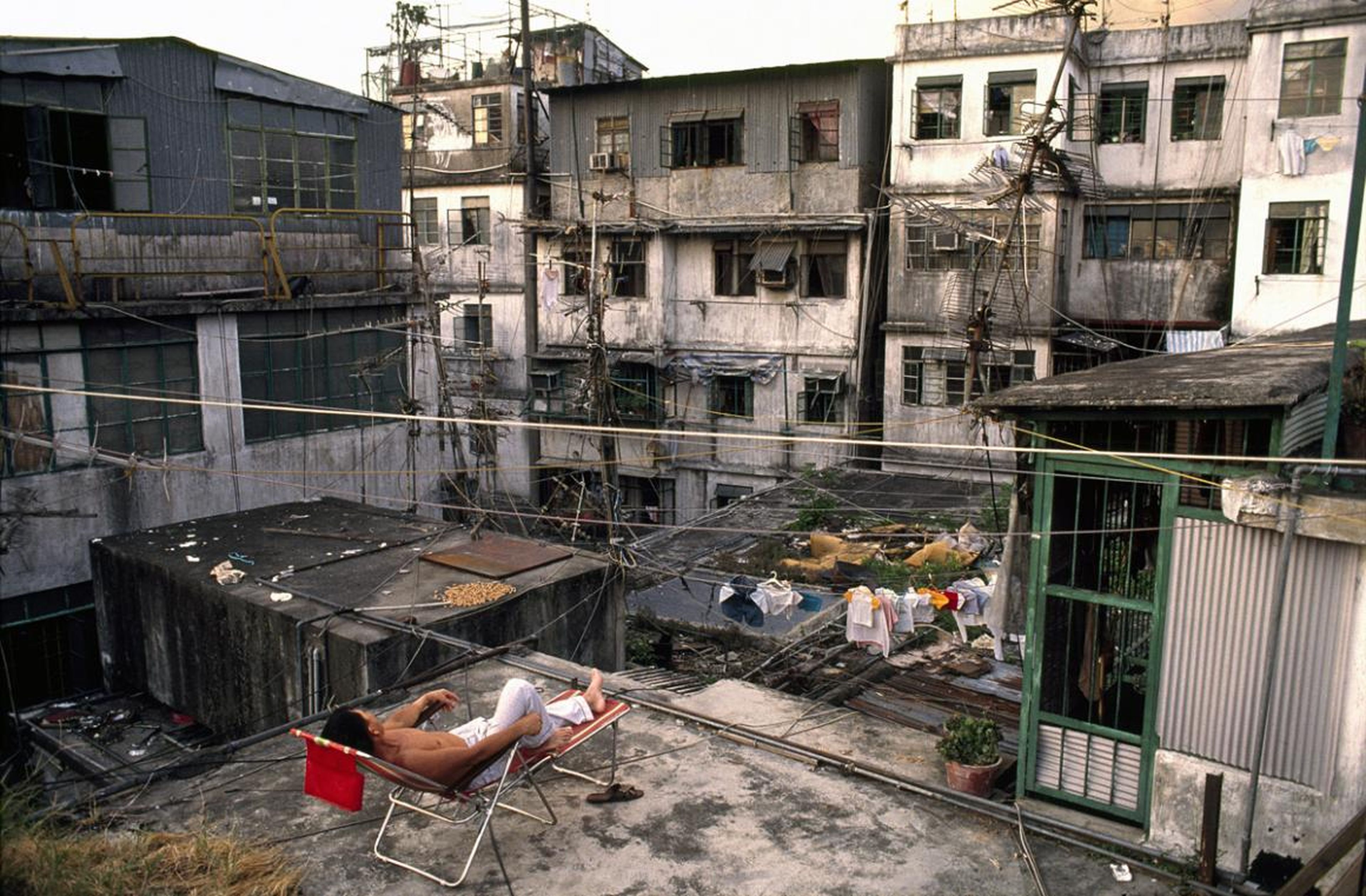 Because of the smelly, humid conditions down below, the rooftops of Kowloon would turn into a communal hangout during the afternoons and evenings. People would hang out, do laundry or homework, or practice instruments.
