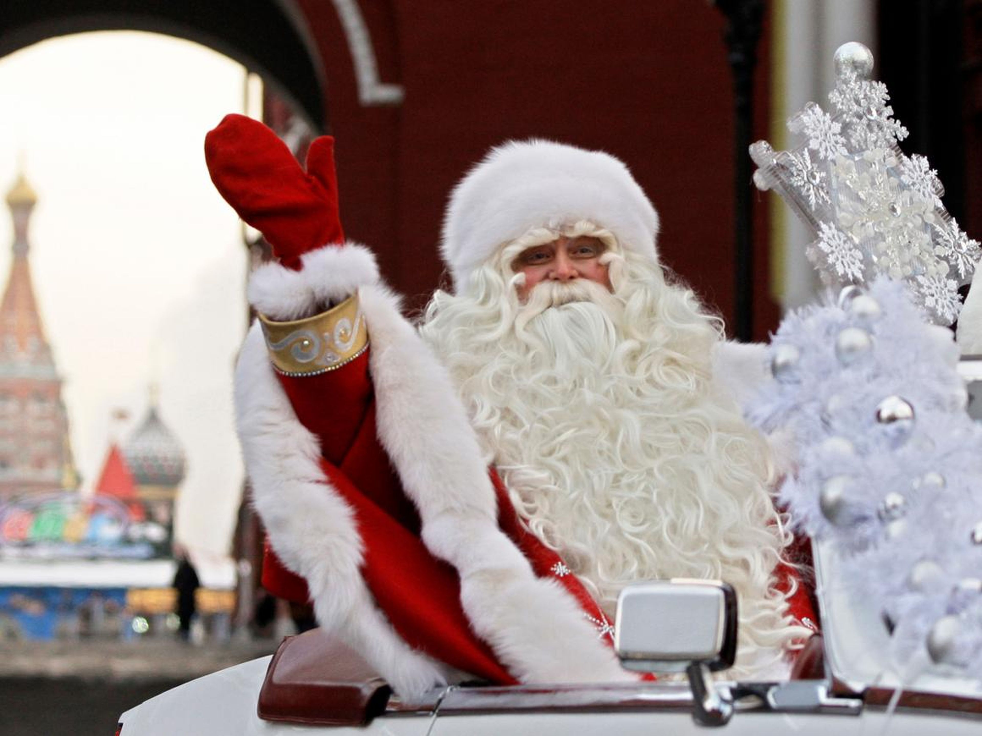 In this Friday, Dec. 26, 2008 file photo, Father Frost, the Russian equivalent to Santa Claus, waves during a welcome ceremony near Red Square