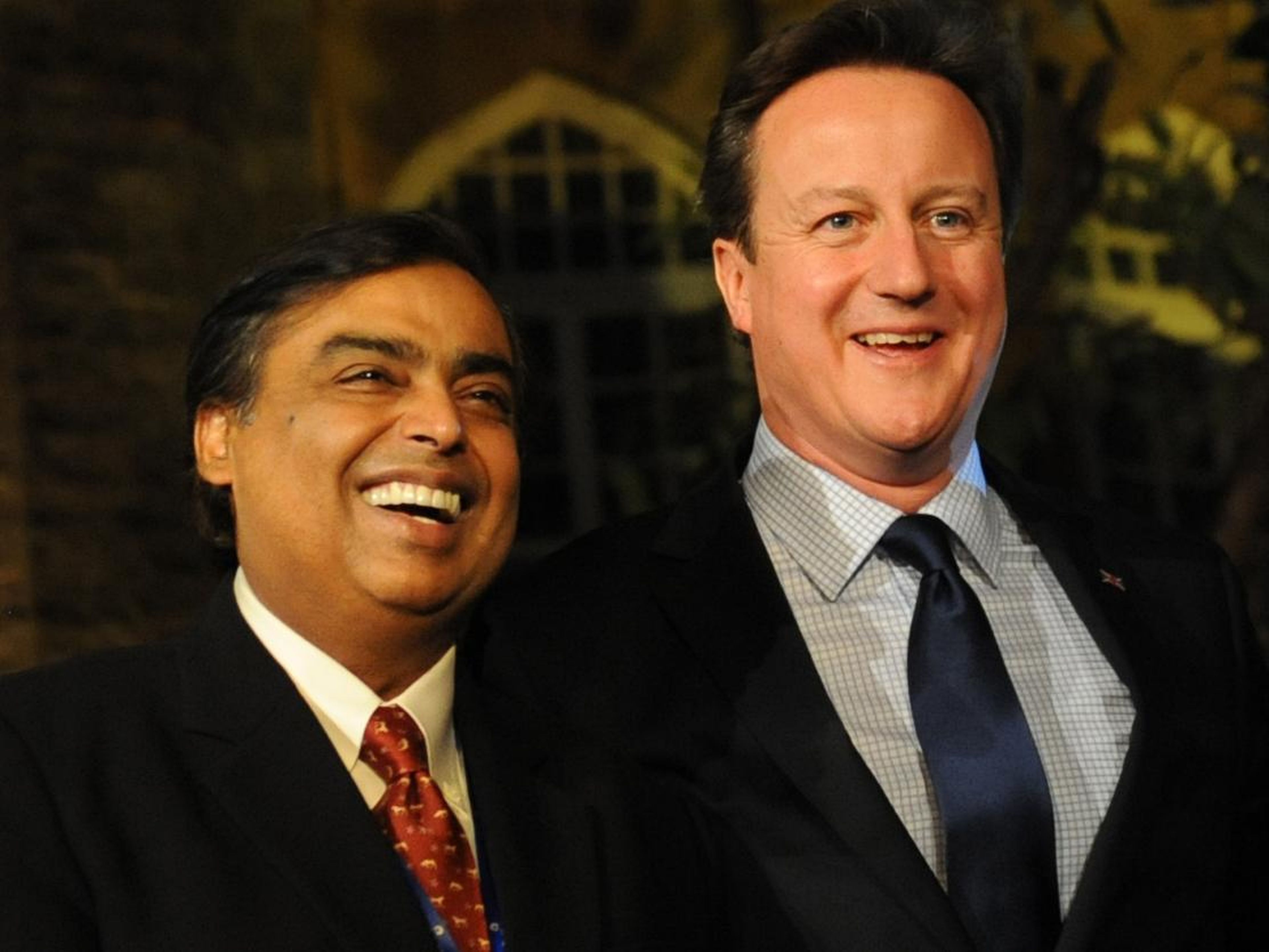 Mukesh Ambani and David Cameron at a reception for Indian and British businessmen and women in Mumbai in 2013.