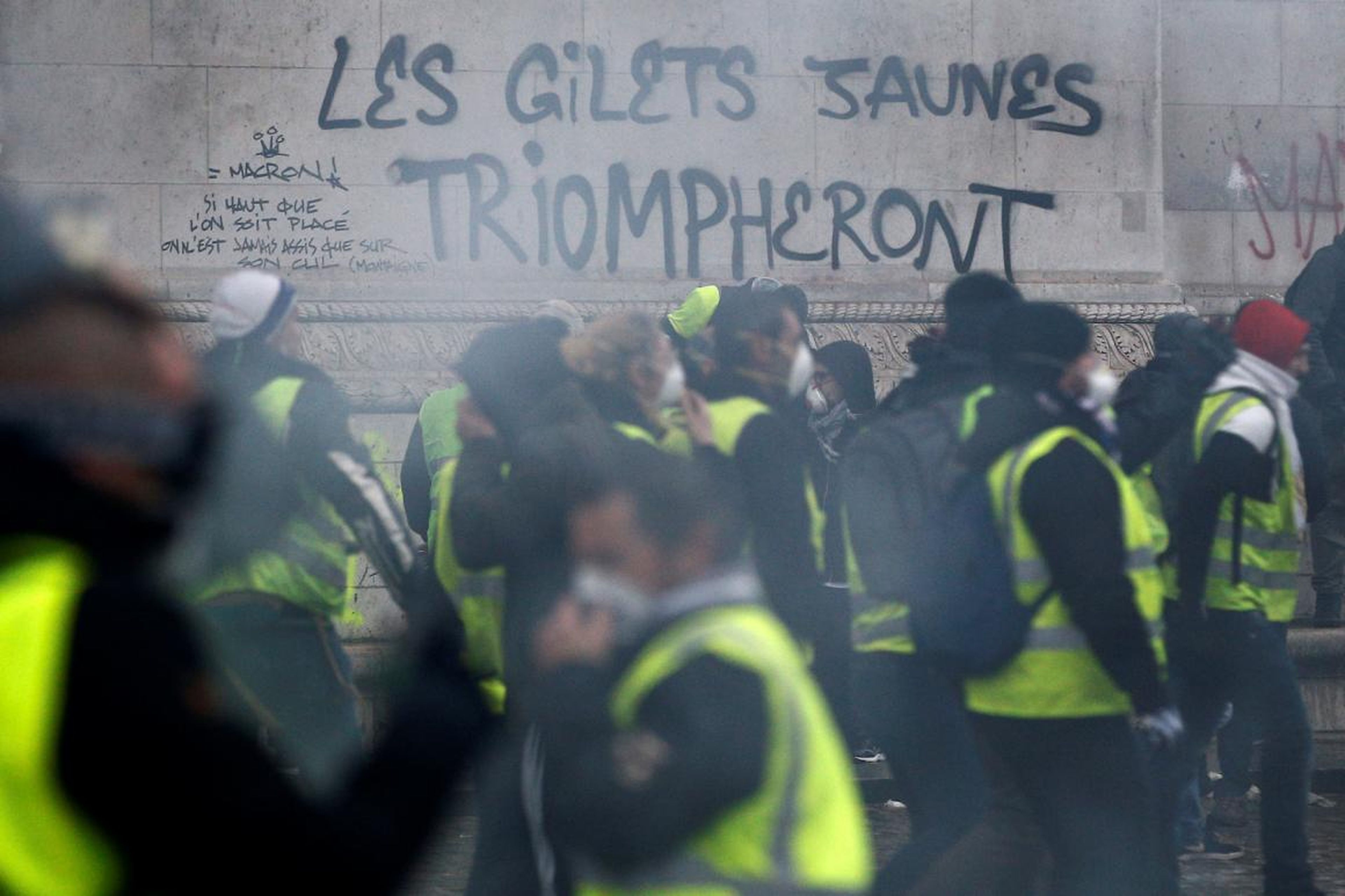 Graffiti saying "the yellow vests will triumph" and disparaging the French president was scrawled on monuments like the Arc de Triomphe.