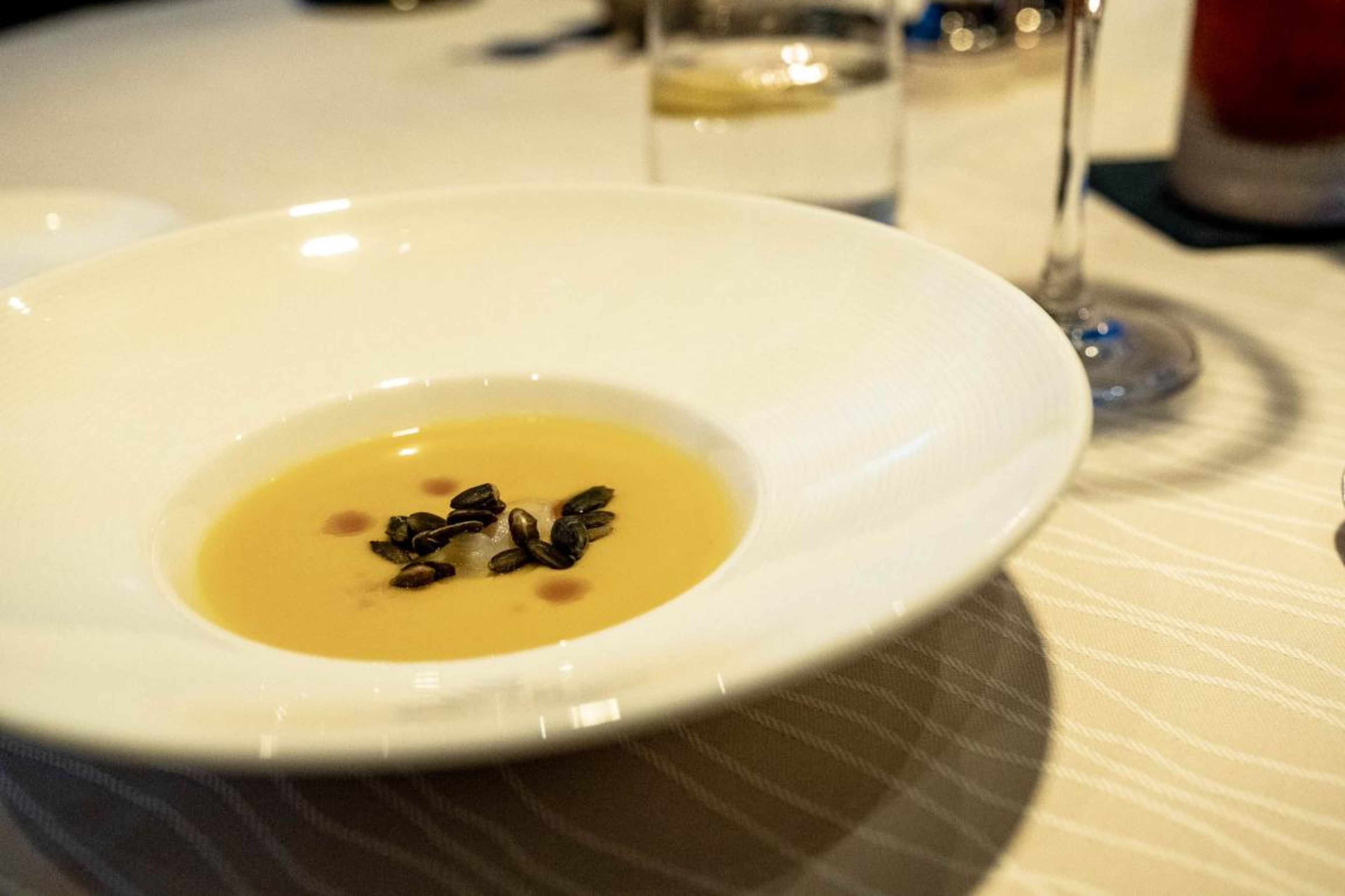 Before I even had the chance to order, the water brought over an amuse-bouche —that's a small, complimentary hors d'œuvre — of butternut squash soup. The mellow soup was brought alive by smoked pumpkin seeds and slivers of briny