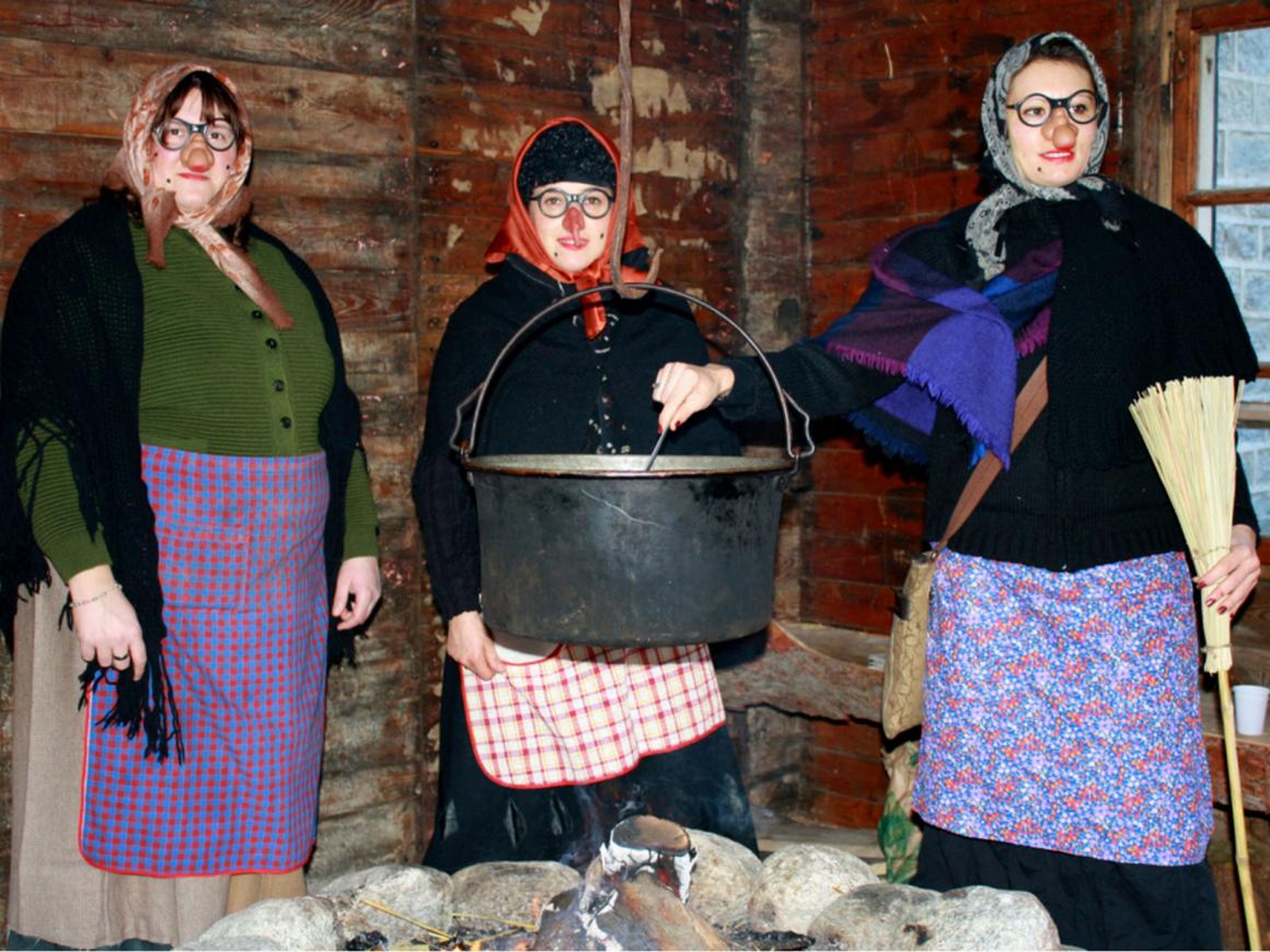 Three women dressed as La Befana.