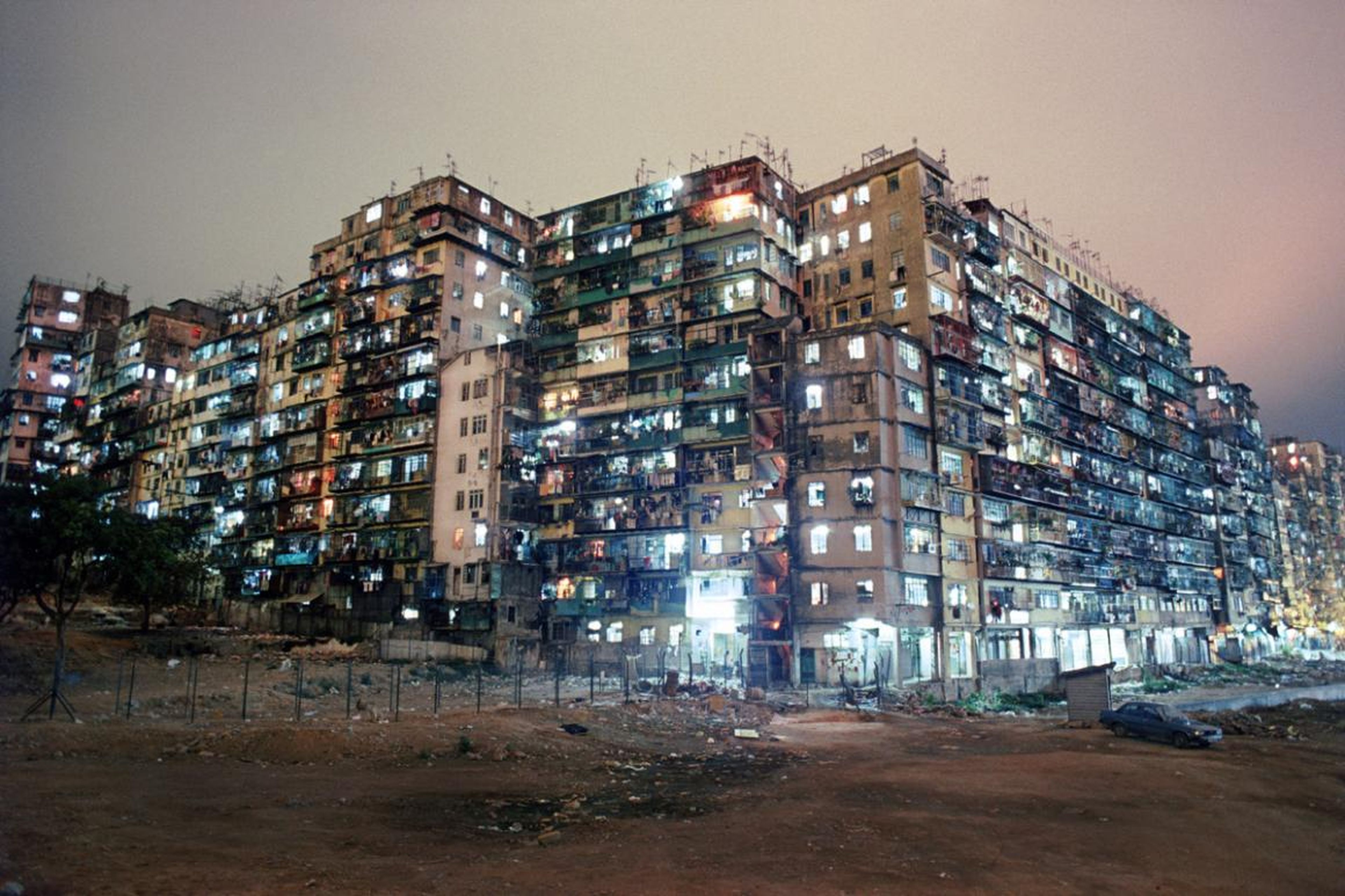 Kowloon Walled City was a densely populated, ungoverned settlement in Kowloon, an area north of Hong Kong Island. What began as a Chinese military fort evolved into a squatters' village comprising a mass of 300 interconnected high