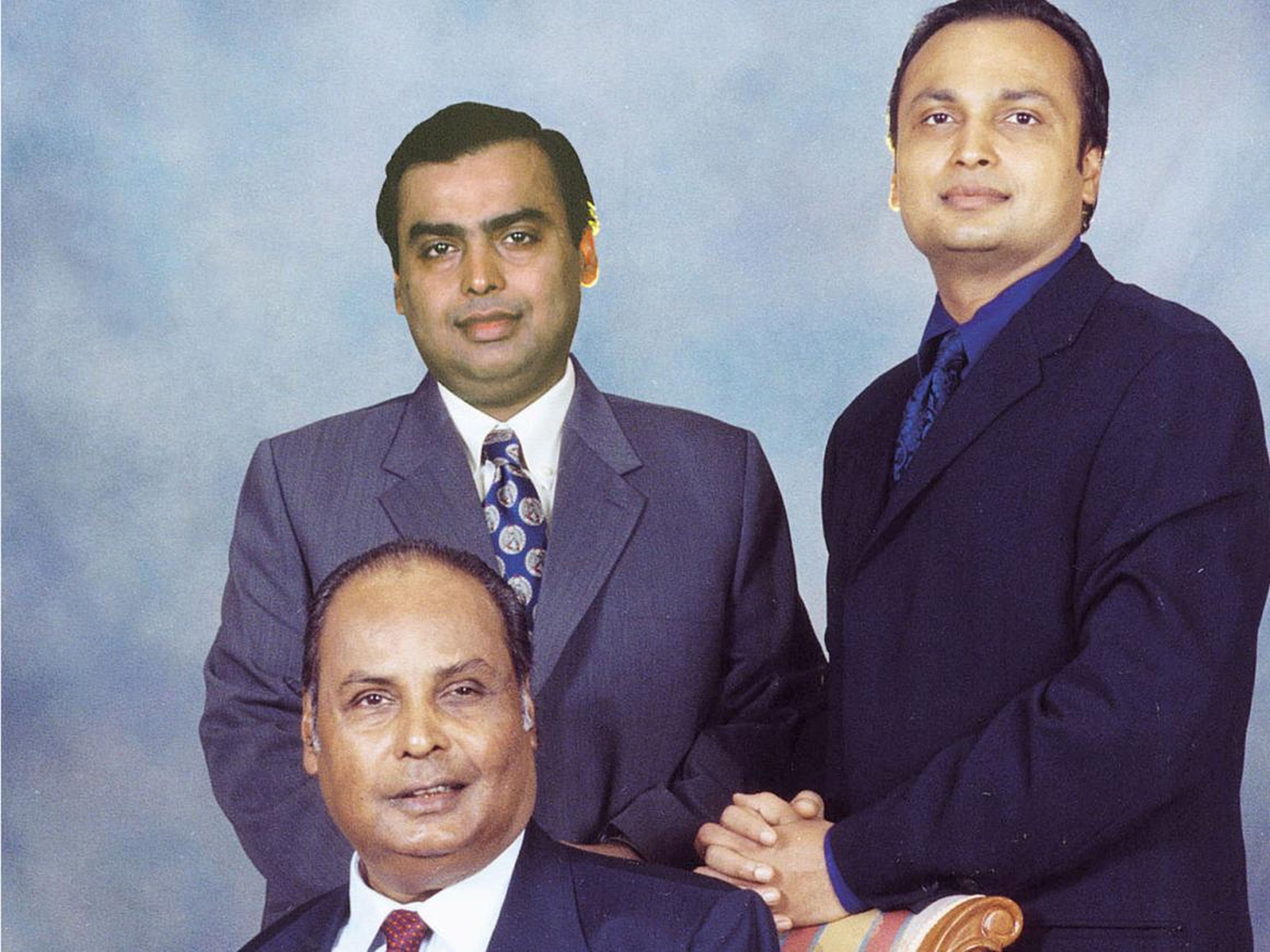 Dhirubhai poses with his sons, Mukesh, left, and Anil, right, in 2000.