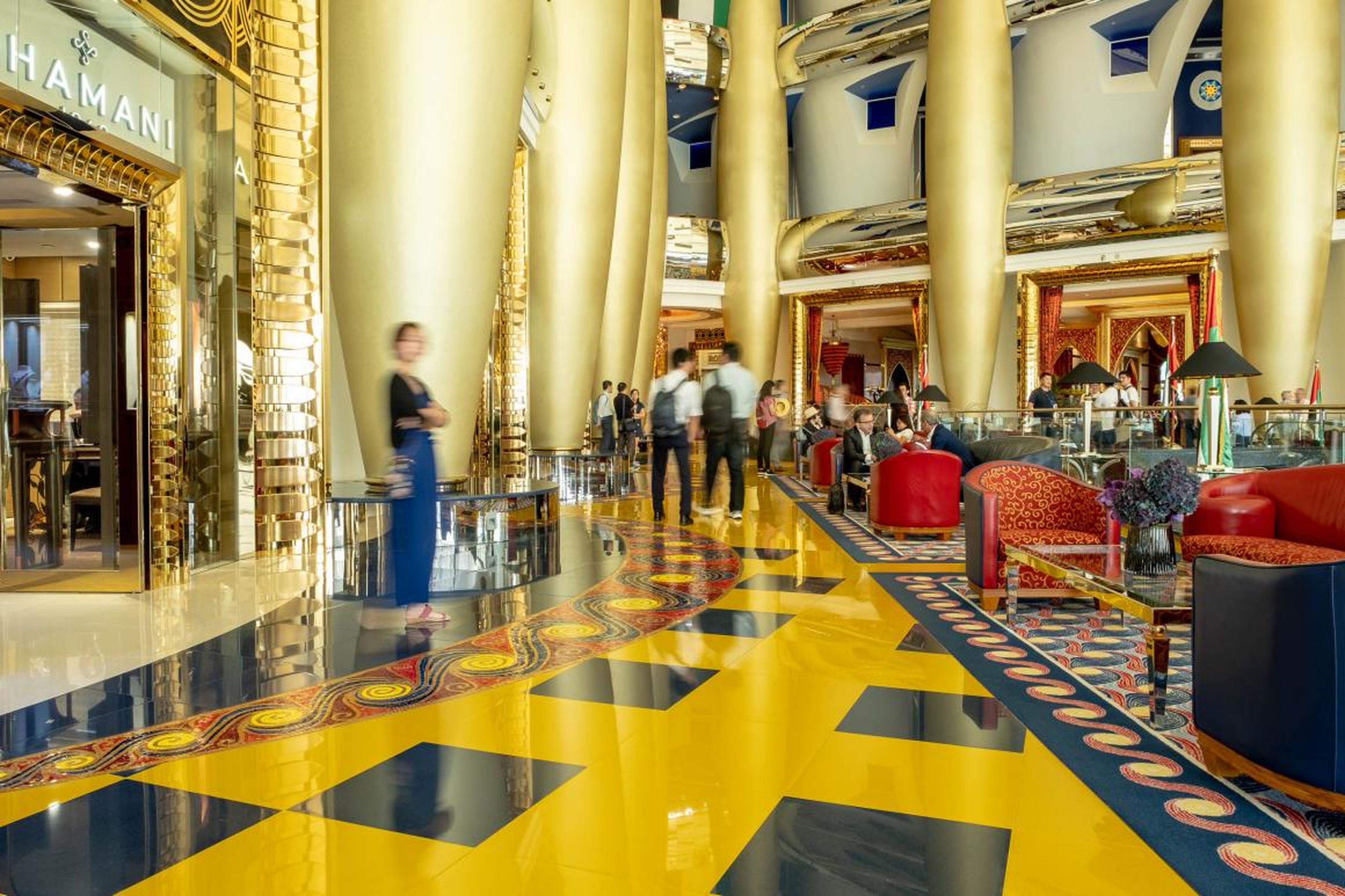 The over-the-top grandeur of the Burj hit me as I entered the atrium. It's not just the gold, though there's plenty of that, but the deep color of the saffron and ultramarine tiles and the ornate furniture.