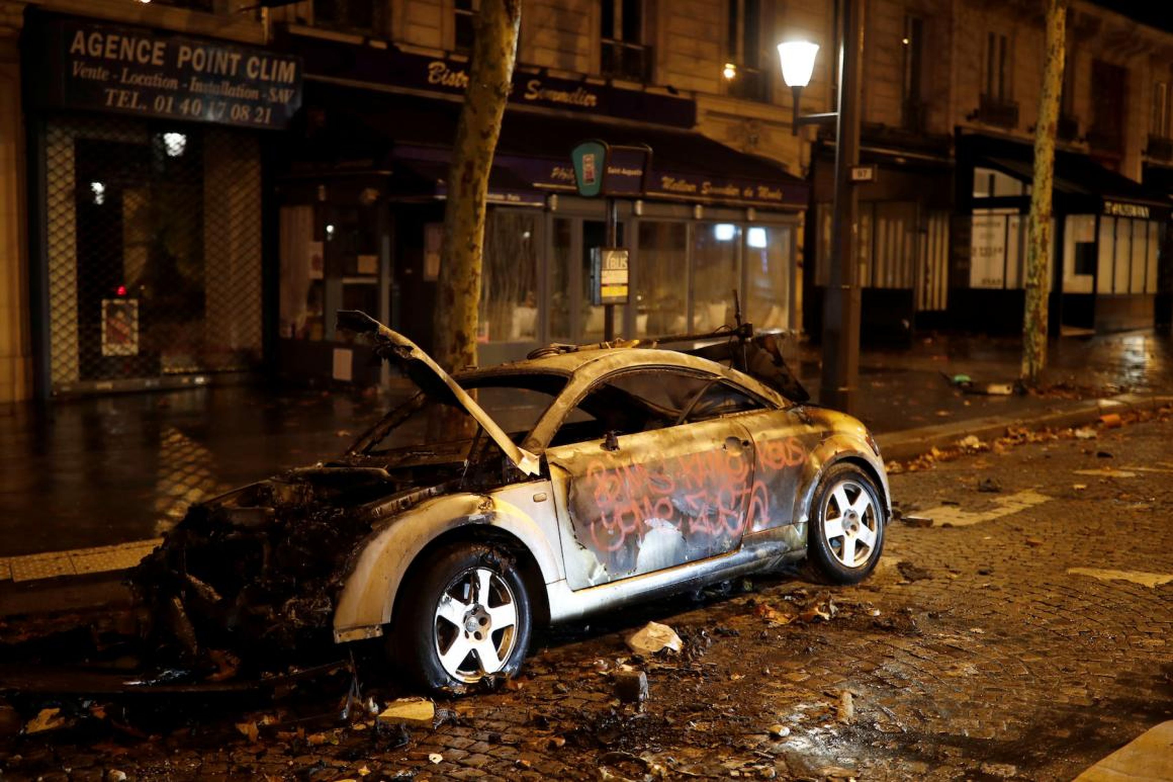 The streets were left lined with vandalized and torched cars.